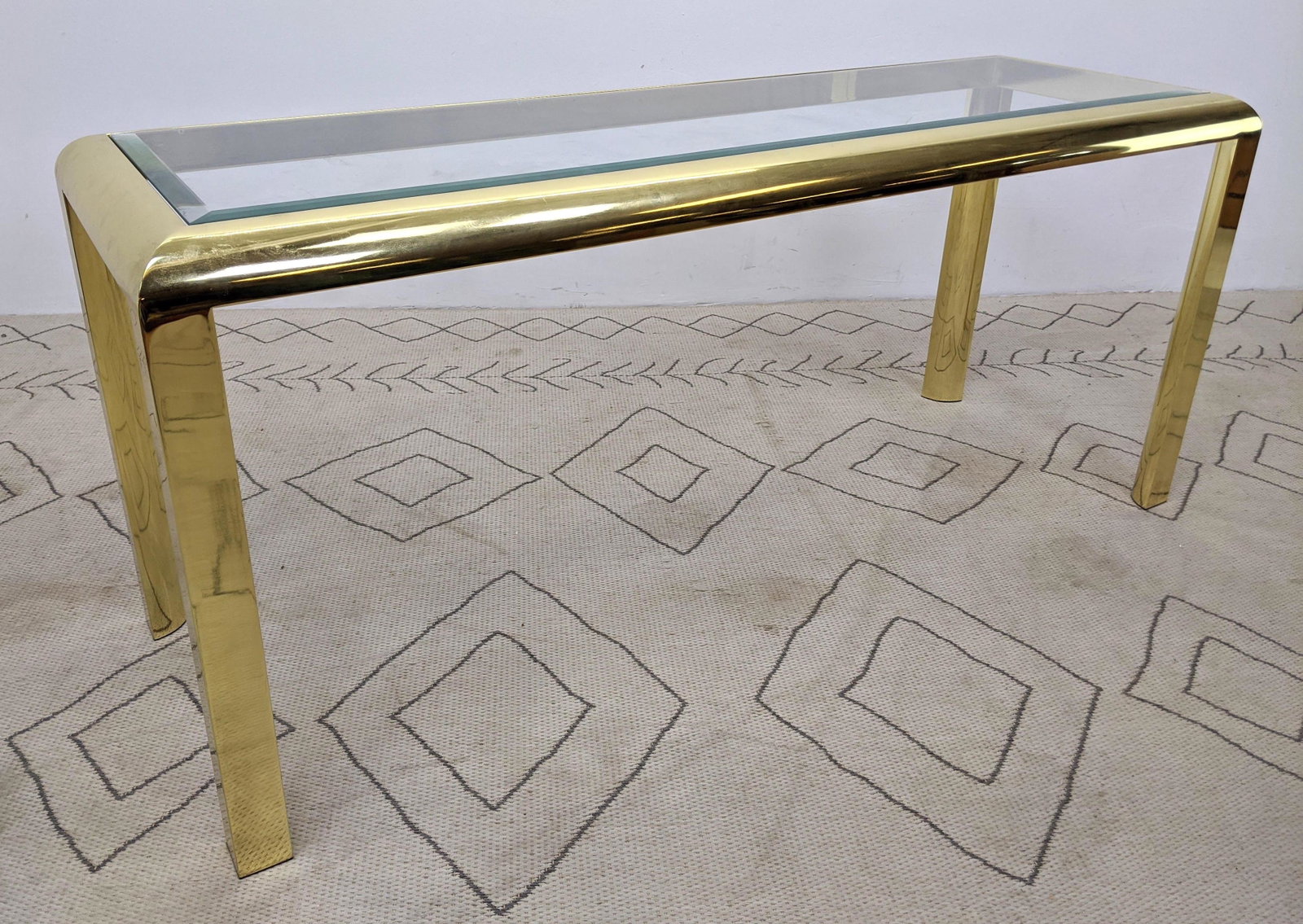 80s Modern Gold Tone and Glass Console Table.: 80s Modern Gold Tone and Glass Console Table. -- Dimensions: H: 27 inches: W: 61.5 inches: D: 20.5 inches ---