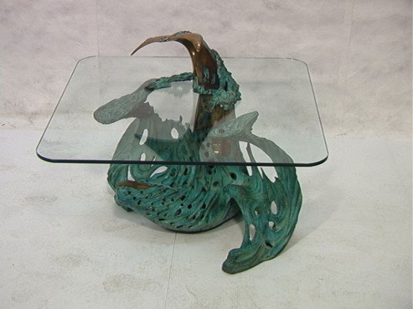 Bob Bennett Bronze Whale Table. Heavy Sculptural: Bob Bennett Bronze Whale Table. Heavy Sculptural Base with .5 in thick Glass. California Artist. Dated 88 Signed and Numbered 36/50 Dimensions: H: 26.25 inches: W: 36 inches Condition (General) Please