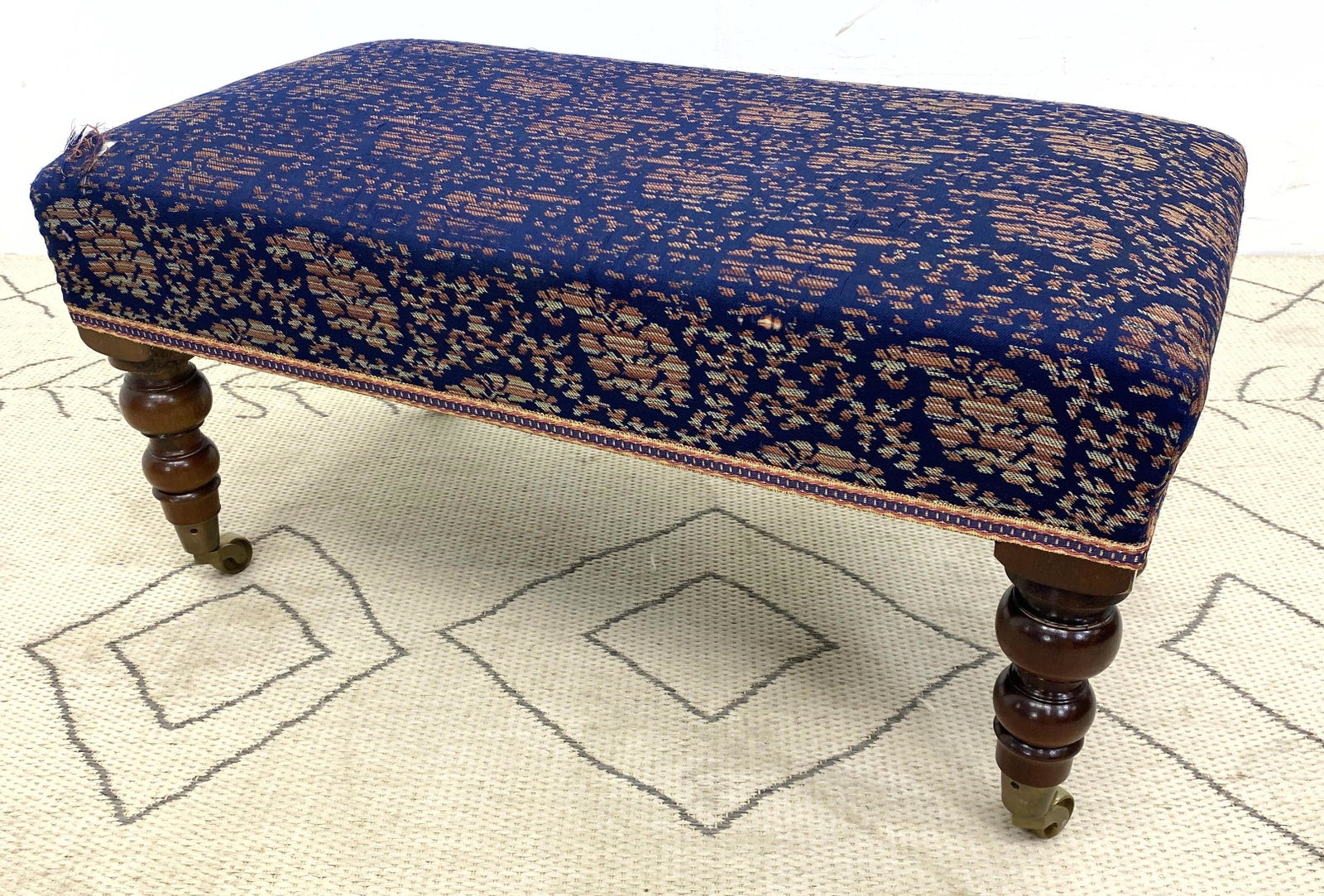 Decorative Turned Leg Ottoman Bench. On casters.: Decorative Turned Leg Ottoman Bench. On casters. -- Dimensions: H: 15 inches: W: 31 inches: D: 17 inches ---