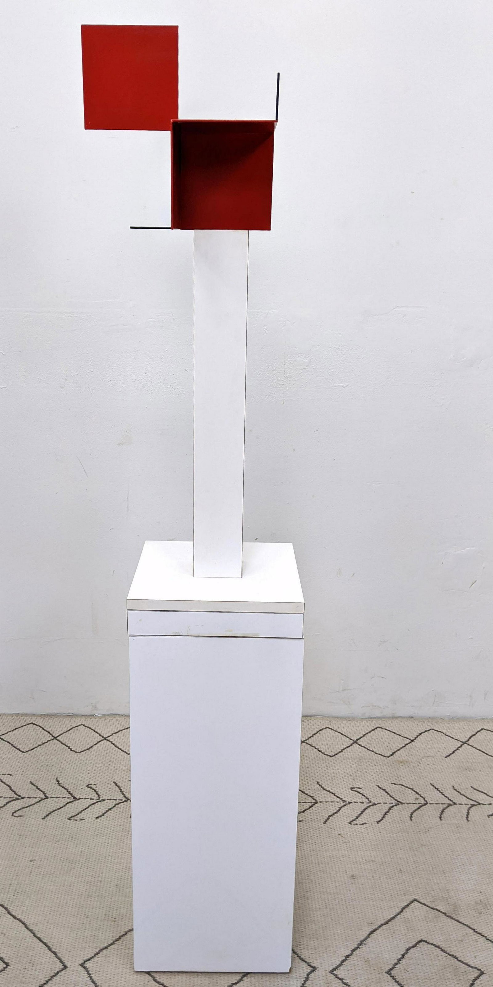 GEORGE D'AMATO Minimalist Enameled Steel Sculpture. Red: GEORGE D'AMATO Minimalist Enameled Steel Sculpture. Red deconstructed squares on white laminate base. Comes with laminate revolving pedestal. D'AMATO was an award winning art director who worked on aw