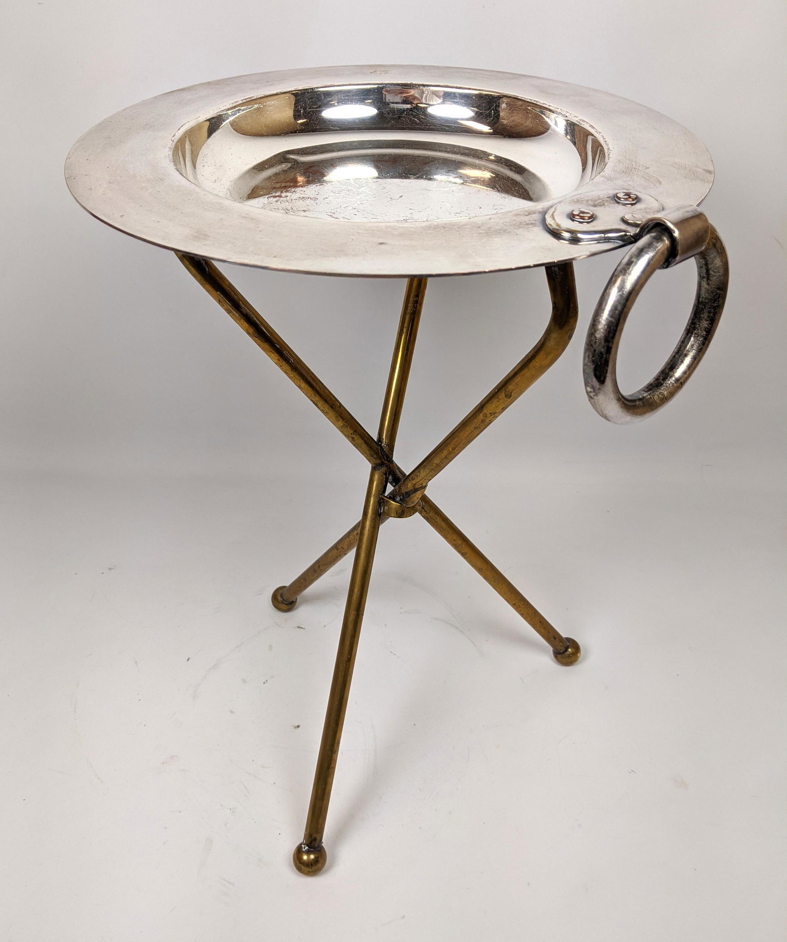 Silver Plate and Brass Taboret Table. Folding with han: Silver Plate and Brass Taboret Table. Folding with hanging ring. -- Dimensions: H: 16 inches: W: 12 inches: D: 12 inches ---