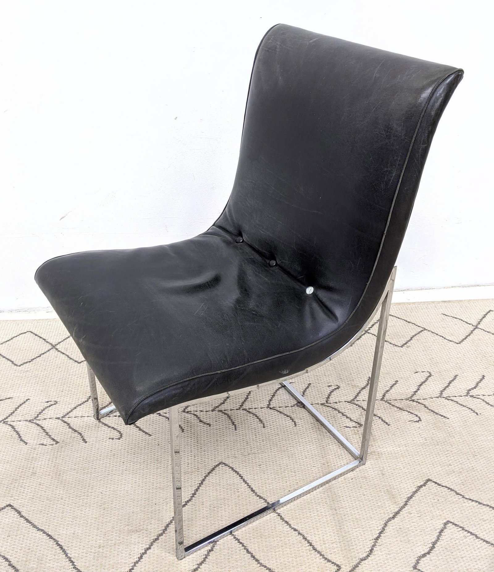 Milo Baughman Armless Chrome Framed Chair. Black Leath: Milo Baughman Armless Chrome Framed Chair. Black Leather.-- Dimensions: H: 33 inches: W: 20 inches: D: 24 inches ---