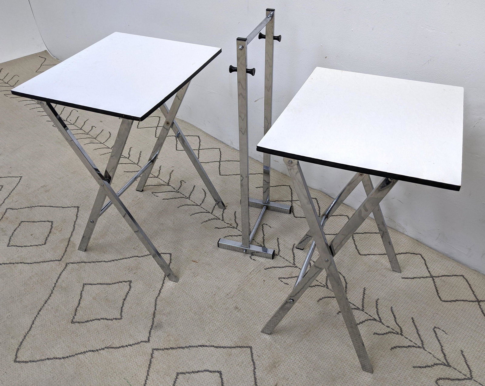 Chrome and white laminate TV snack tables Vintage: Chrome and white laminate TV snack tables Vintage-- Dimensions: H: 30 inches: W: 18 inches: D: 8 inches ---