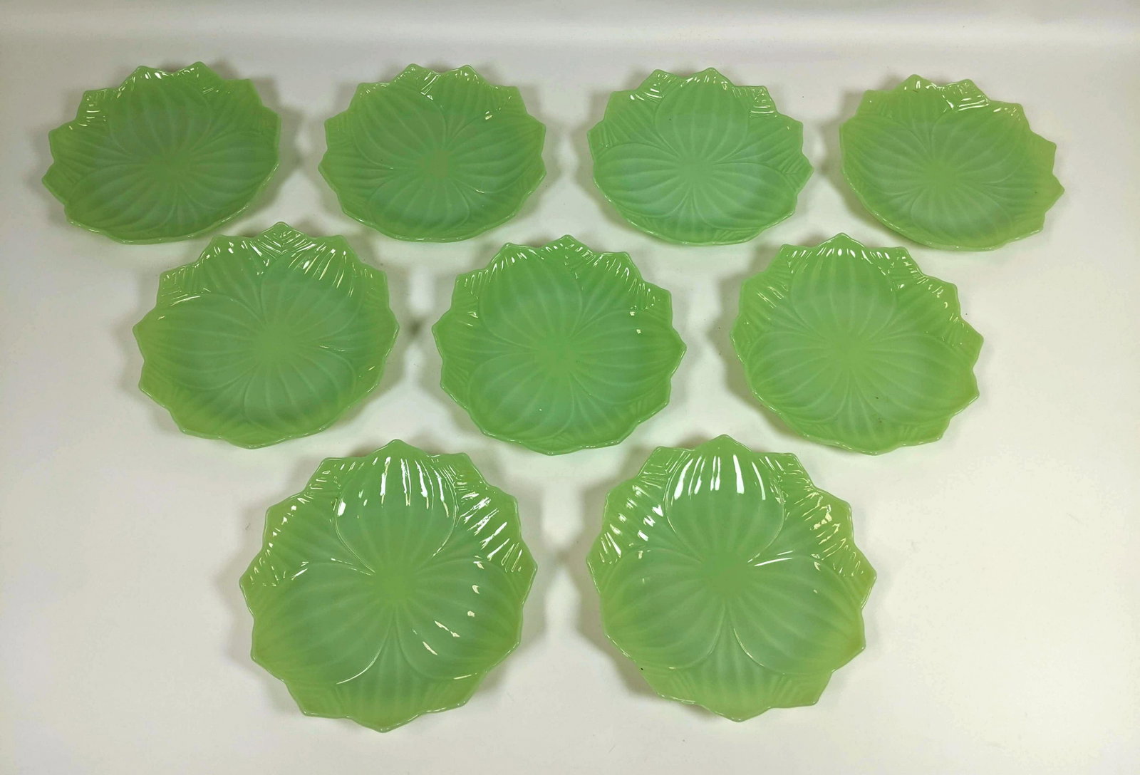 9pcs Green Jadeite Glass Plates with Scalloped edges.: 9pcs Green Jadeite Glass Plates with Scalloped edges.-- Dimensions: H: 1 inches: W: 8 inches ---