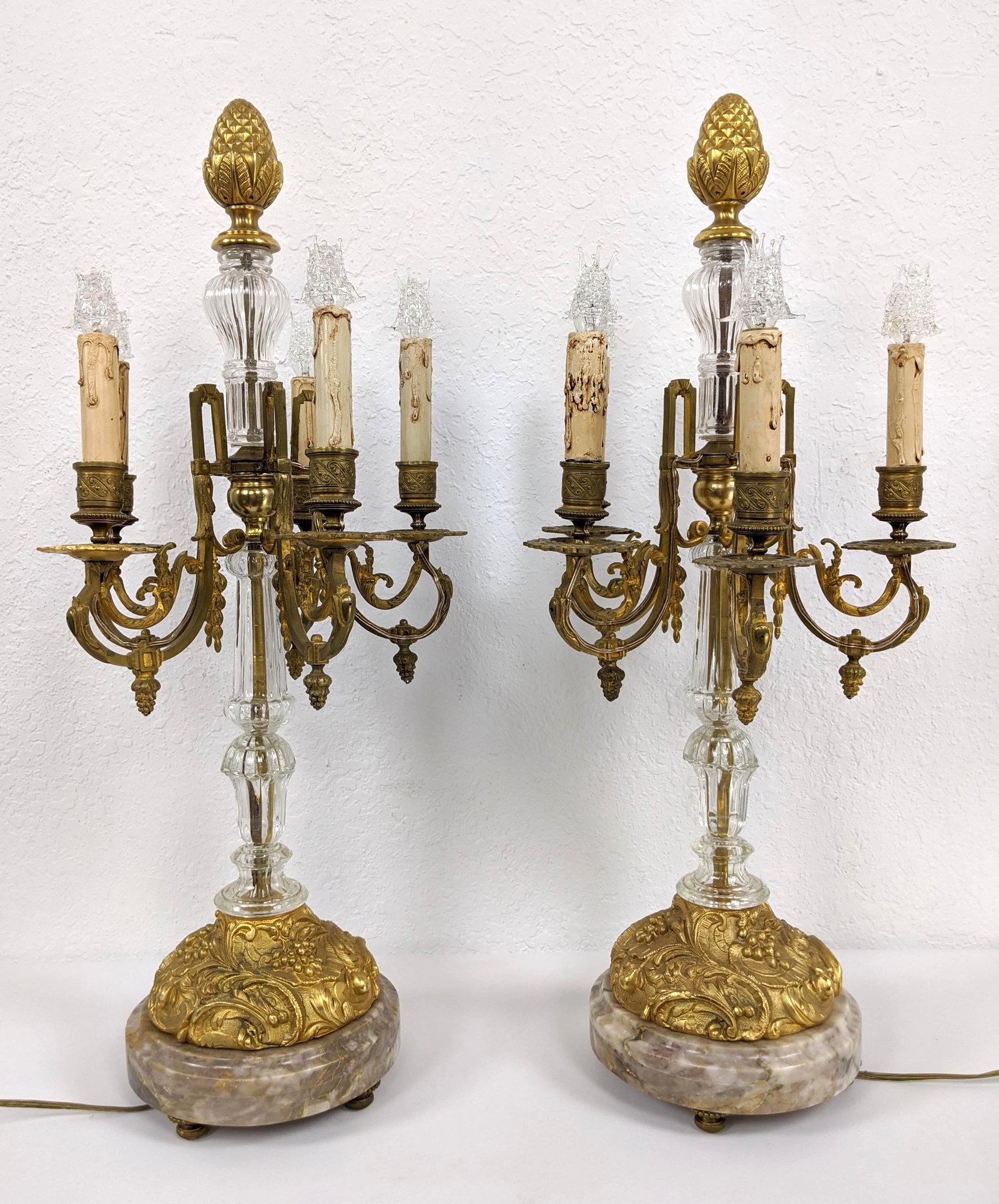 Pr French Crystal Gilt Bronze Ormolu Candelabra. 5 arm: Pr French Crystal Gilt Bronze Ormolu Candelabra. 5 arm candlesticks with decorative glass cage bulbs. Round marble bases. Electrified-- Dimensions: H: 27 inches: W: 12 inches: D: 12 inches ---