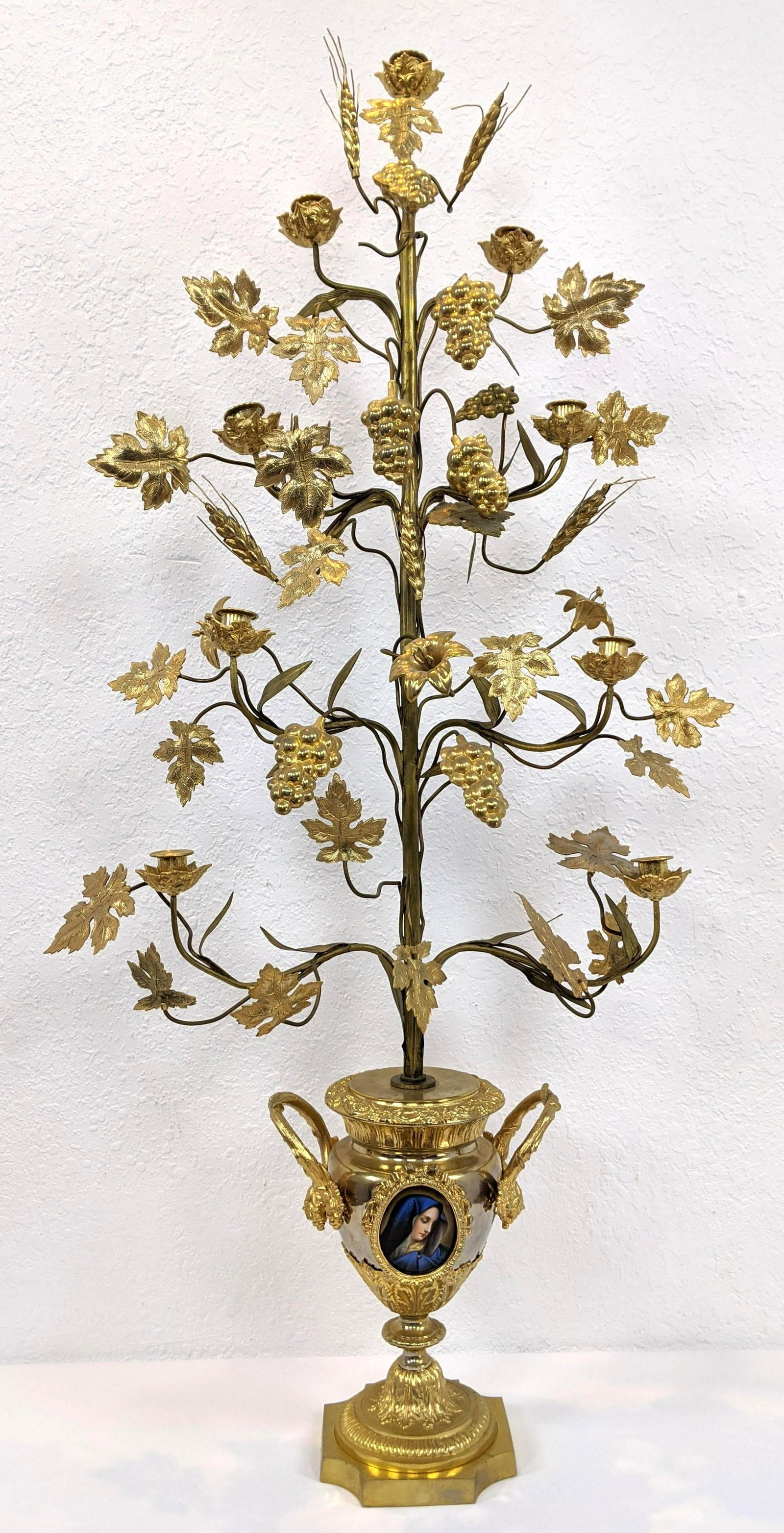 46.5Ó Tall Gilt Metal Grape & Leaf Candelabra. Footed u: 46.5Ó Tall Gilt Metal Grape & Leaf Candelabra. Footed urn base with Sevres style portrait medallion. 9 candle holders-- Dimensions: H: 46.5 inches: W: 23 inches: D: 9 inches ---