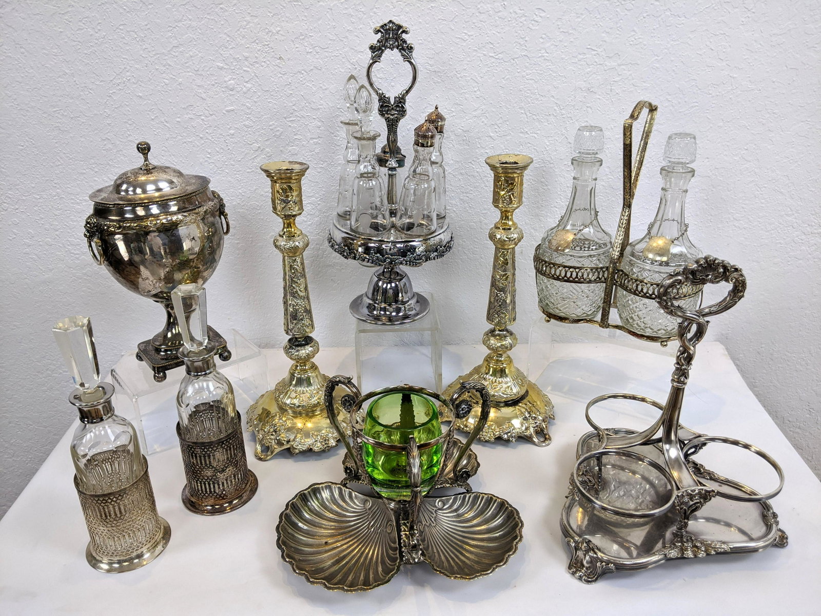 9pc Assorted Silver Plate Table Ware Lot. Victorian cru: 9pc Assorted Silver Plate Table Ware Lot. Victorian cruet set. 2 part decanter with server. Pr fancy candlesticks.-- Dimensions: H: 14.75 inches: W: 7.25 inches: D: 7 inches ---