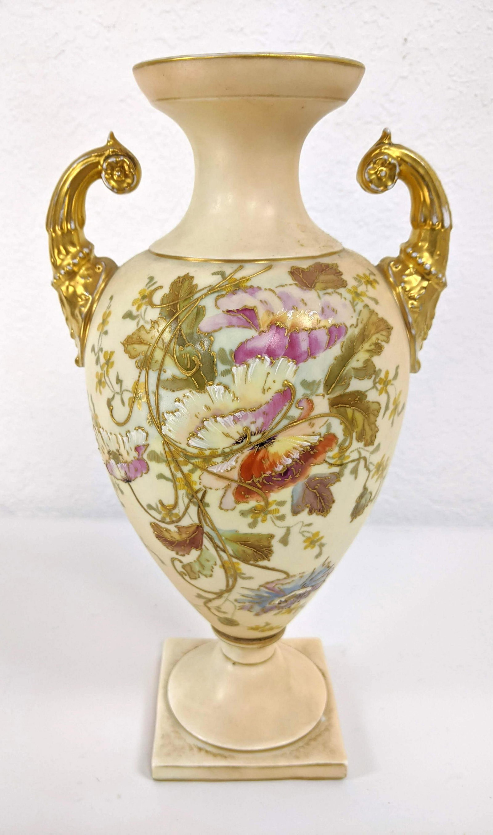 RUDOLSTADT Handled Urn Form Vase. Cream body with poppi: RUDOLSTADT Handled Urn Form Vase. Cream body with poppies. Bolted vase. Raised gilt trim. Marked Royal Worcester Germany Ruvolstat-- Dimensions: H: 12.5 inches: W: 7 inches: D: 5.25 inches ---