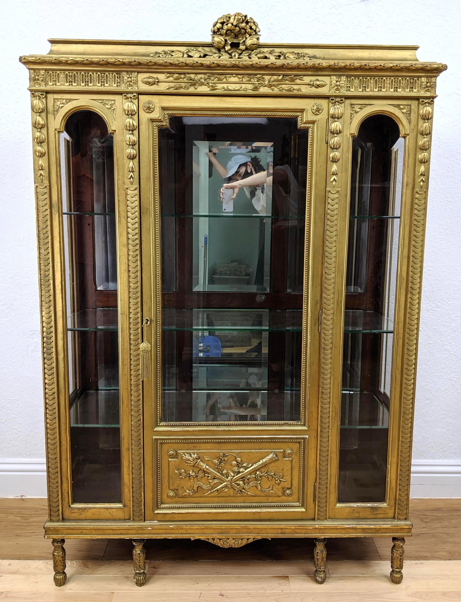 French Gilt Carved Wood Antique China Closet Cabinet Vi: French Gilt Carved Wood Antique China Closet Cabinet Vitrine. Beveled glass door and sides. Mirrored back. Carved floral ribbon crest. Carved feet. Lights up-- Dimensions: H: 66 inches: W: 44 inches: 
