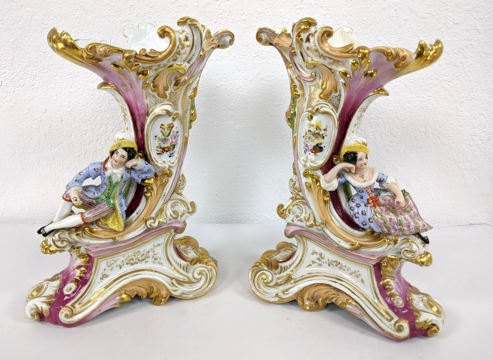Pr Old Paris Porcelain Figural Cornucopia Vases. Male a: Pr Old Paris Porcelain Figural Cornucopia Vases. Male and female reclining figures on highly decorated vase-- Dimensions: H: 14 inches: W: 10.5 inches: D: 5.5 inches ---