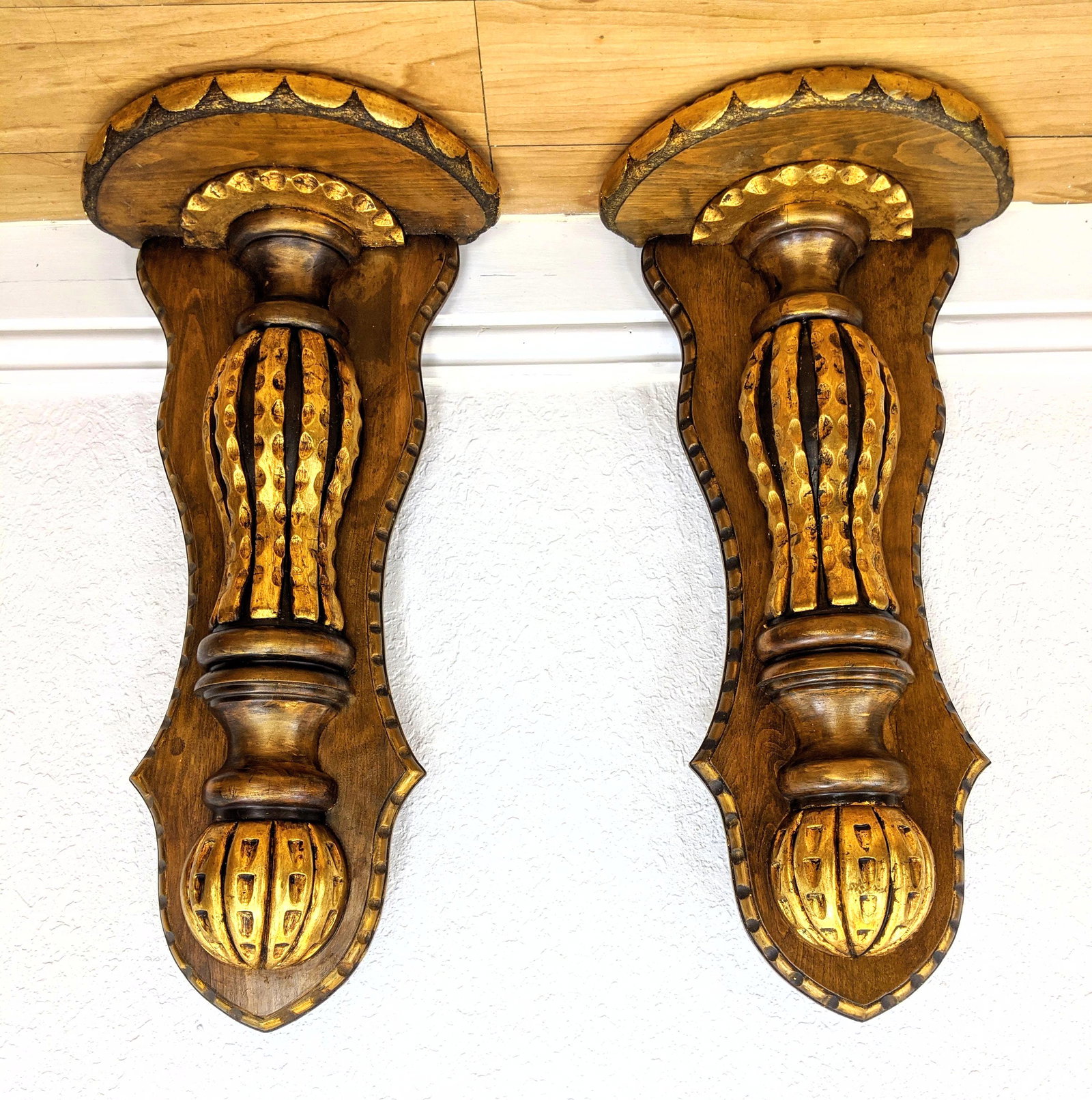 Pair Wood Gold Gilt Decorated Wall Shelf Brackets. Scal: Pair Wood Gold Gilt Decorated Wall Shelf Brackets. Scalloped edge top. Peanut form decorative element-- Dimensions: H: 27 inches: W: 13 inches: D: 7 inches ---