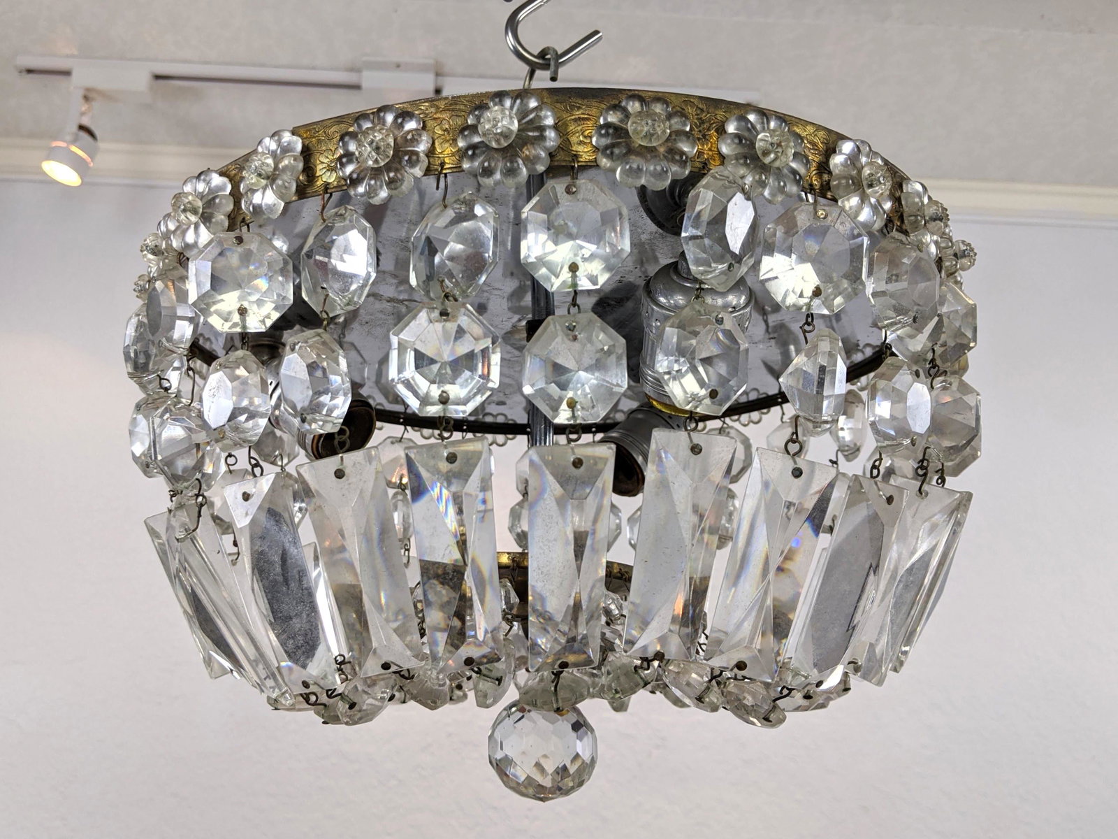Small Crystal Prism Hanging Chandelier. Wired crystal p: Small Crystal Prism Hanging Chandelier. Wired crystal prisms on gold colored frame. Prism ball details-- Dimensions: H: 8 inches: W: 12.5 inches: D: 12.5 inches ---