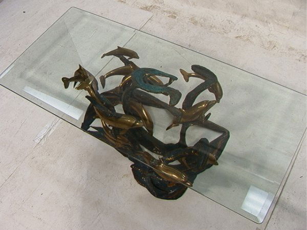 Bob Bennett Bronze Coffee Cocktail Table. Sealif: Bob Bennett Bronze Coffee Cocktail Table. Sealife bronze base with Dolphins. Large .5in thick glass top. Unsigned. Base is 15x35x21 Dimensions: H: 15.5 inches: W: 48 inches: L: 56 inches Condition (Ge