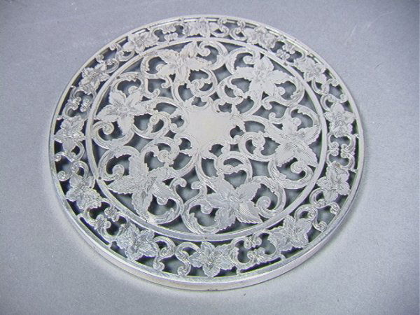 Sterling Overlay and Glass Trivet Coaster. Thick: Sterling Overlay and Glass Trivet Coaster. Thick sterling overlay Dimensions: : W: 6 inches Condition (General) Please contact us with specific questions about condition, not visible in the photos: Ve