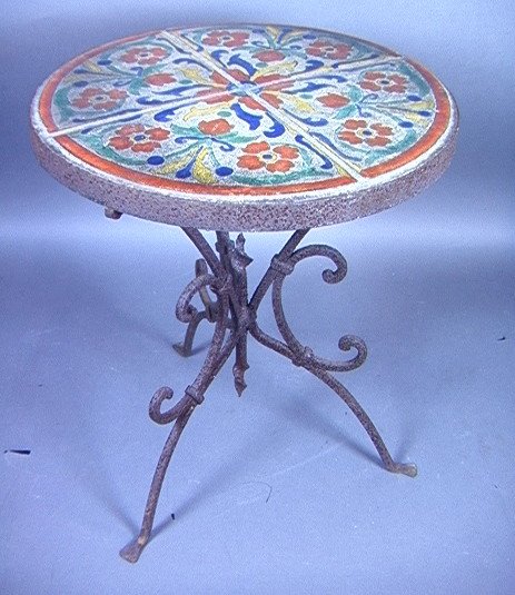 California Tile top Iron Plant table Round with w: California Tile top Iron Plant table Round with worked base. Dimensions: H: 20 inches: W: 16 inches Condition (General) Please contact us with specific questions about condition, not visible in the ph