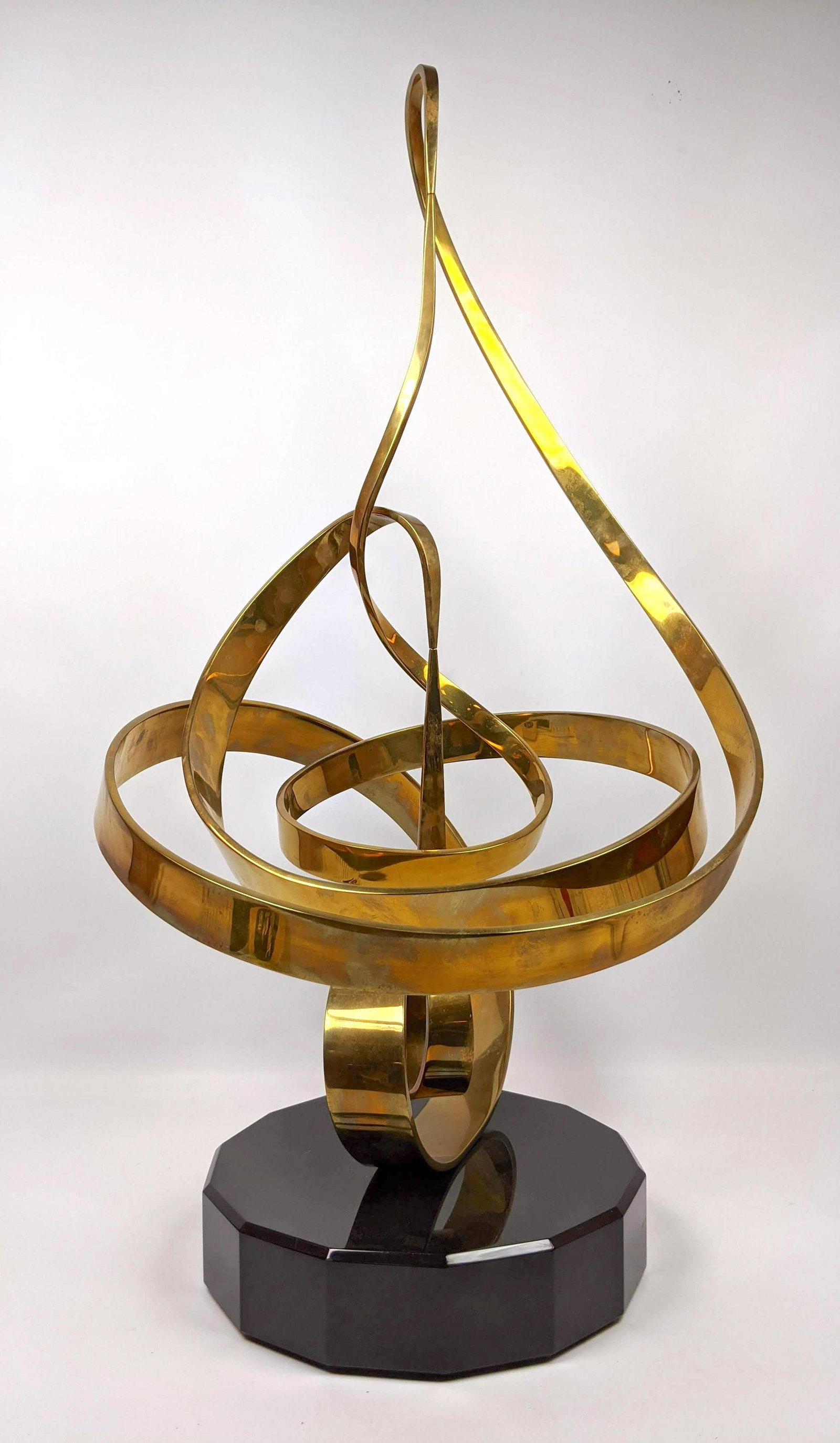 Large CLAYTON WHITEHOUSE Kinetic Sculpture. Polished Br: Large CLAYTON WHITEHOUSE Kinetic Sculpture. Polished Brass Kinetic Sculpture. Large Ribbon Form with Revolving Center. -- Dimensions: H: 32 inches: W: 17 inches: D: 17 inches ---