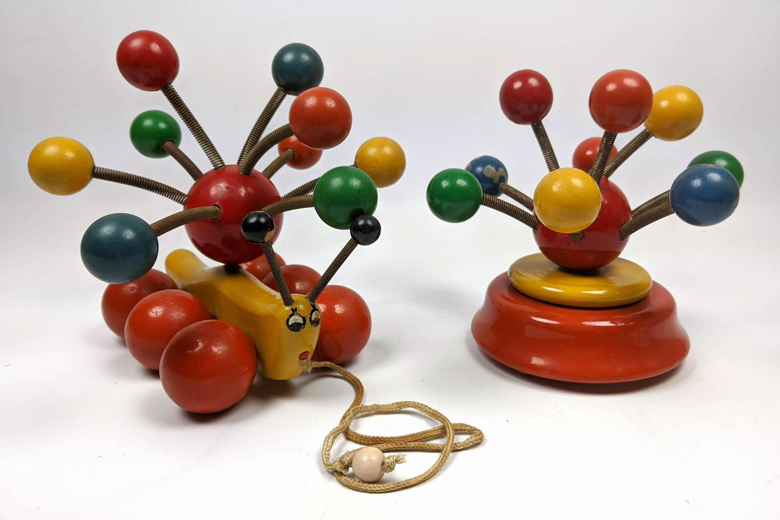 KOUVALIAS Mid Century Modern Wood and Spring Toys. Colo: KOUVALIAS Mid Century Modern Wood and Spring Toys. Colorful. -- Dimensions: H: 7 inches: W: 8 inches: D: 8 inches ---