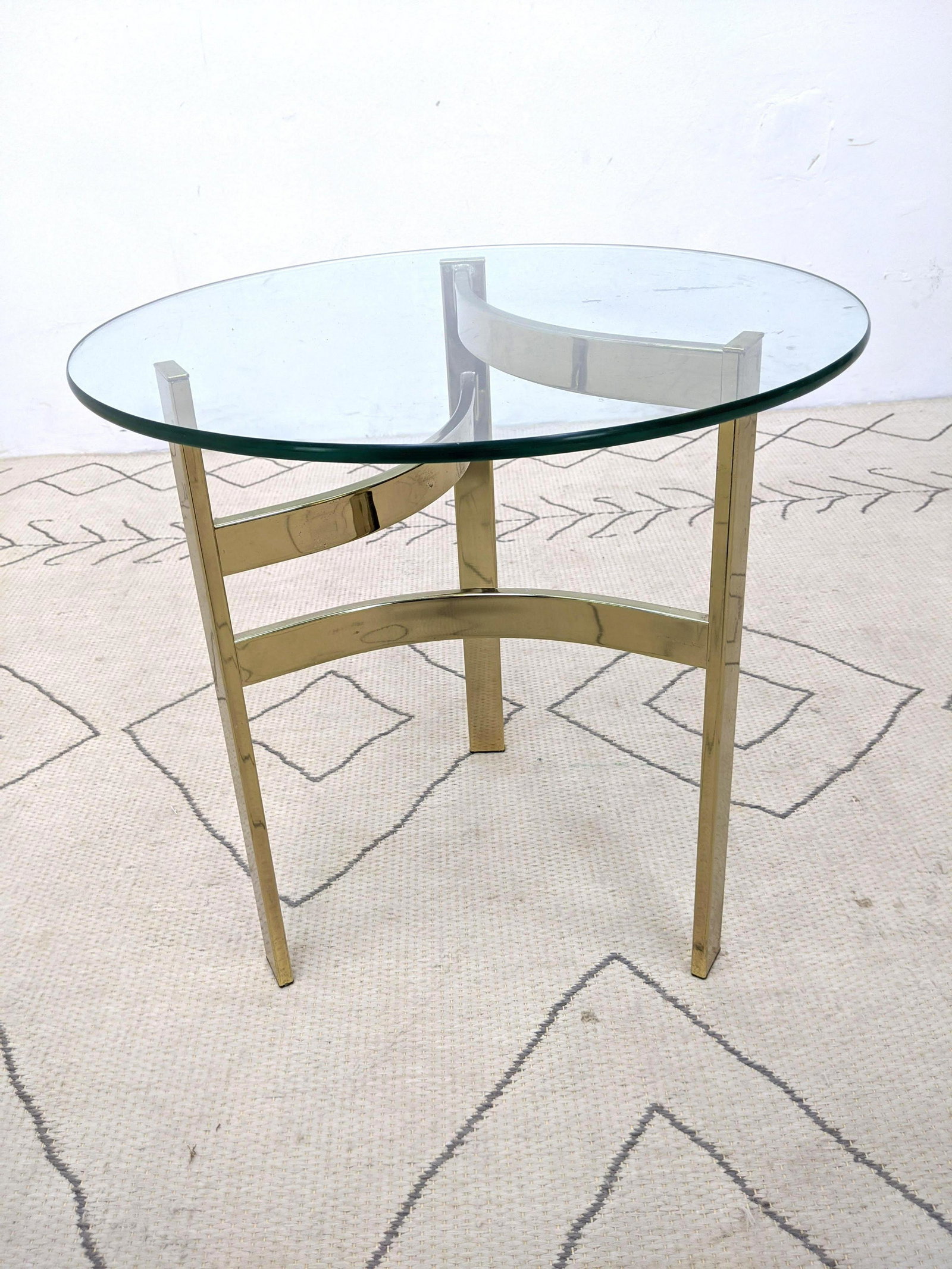 Gold Tone and Glass Side Table. Three leg base.: Gold Tone and Glass Side Table. Three leg base.-- Dimensions: H: 20.25 inches: W: 20 inches: D: 20 inches ---