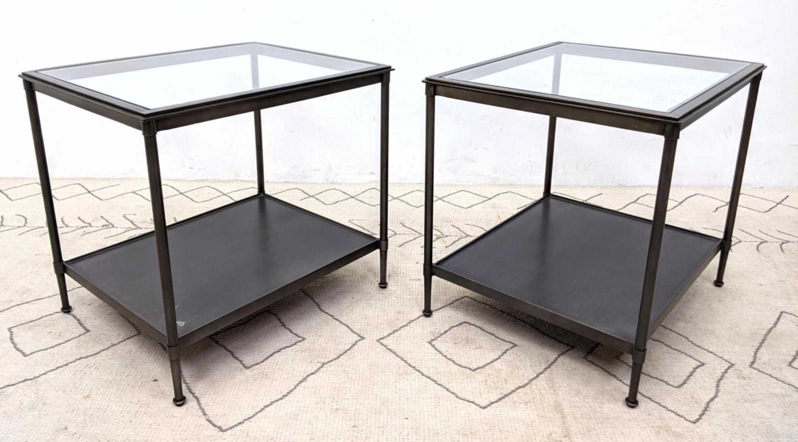 Pair Contemporary Iron and Glass Side Tables. Gun metal: Pair Contemporary Iron and Glass Side Tables. Gun metal finish. -- Dimensions: H: 22.5 inches: W: 24 inches: D: 20 inches ---