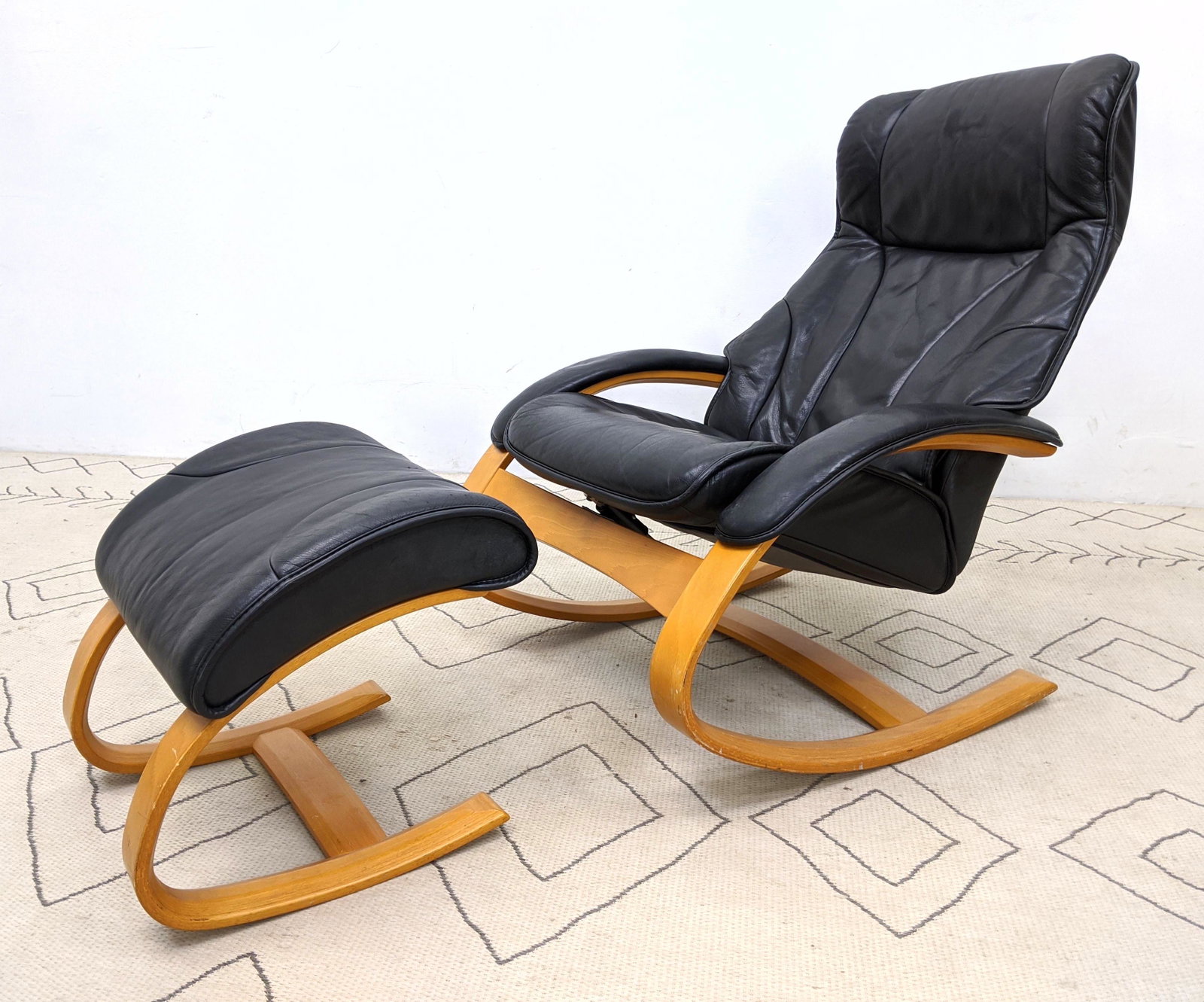 Modernist Molded Wood and Leather Rocking Chair and Ott: Modernist Molded Wood and Leather Rocking Chair and Ottoman. -- Dimensions: H: 39 inches: W: 30 inches: D: 32 inches ---