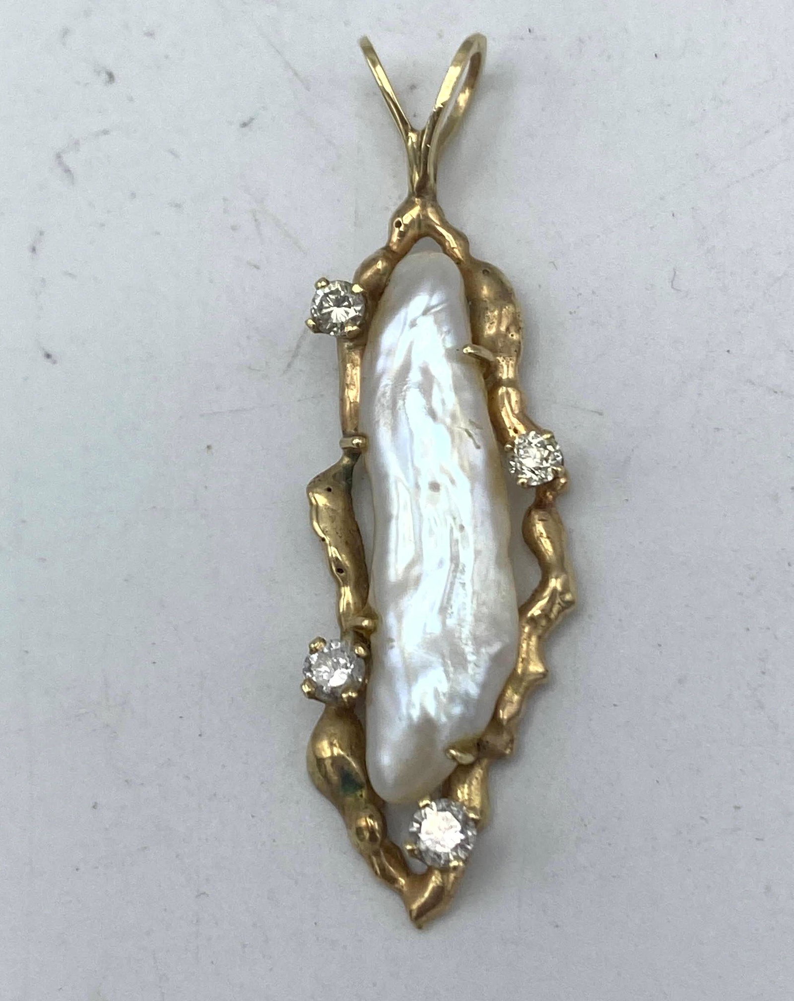 14k Gold Baroque Pearl and Diamond Pendant.: 14k Gold Baroque Pearl and Diamond Pendant. -- Dimensions: H: 2.25 inches: W: .5 inches: D: .25 inches--- Weight: 4.2 DWT --- US Shipping charge: $15 Plus insurance at a rate of $1 per hundred.