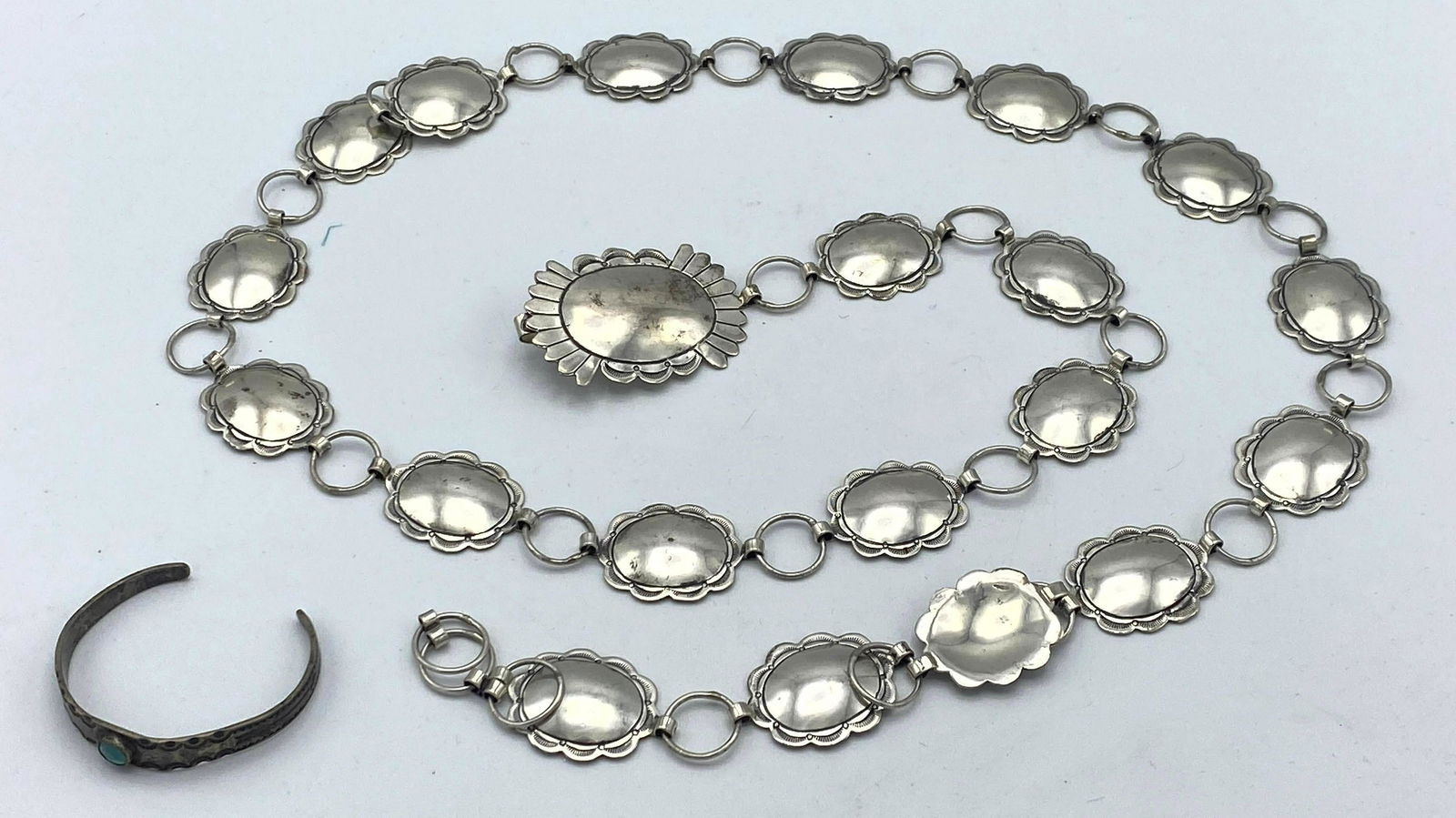 Sterling MJ Native American Indian Concho Belt. Small: Sterling MJ Native American Indian Concho Belt. Small turquoise bracelet with stamped design. -- Dimensions: : W: 1.5 inches: L: 42 inches--- Weight: 3.8 Troy ozs. ---- --- US Shipping charge: $20 Plu