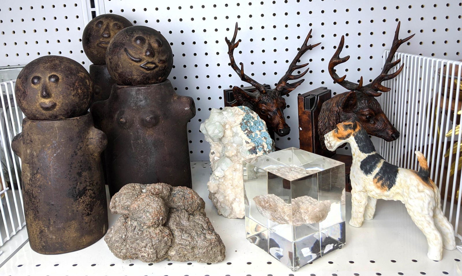 Shelf Lot: Pottery figures, Elk bookends, Geodes. (1 of 13)