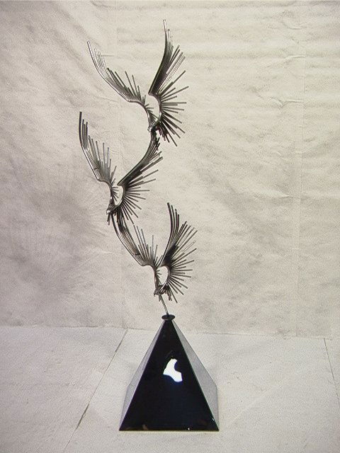 Large Curtis JERE Birds in Flight Sculpture. Thr: Large Curtis JERE Birds in Flight Sculpture. Three birds in flight on pyramid base. Signed and dated, 1978. Dimensions: H: 73 inches: W: 22 inches: D: 18 inches Condition (General) Please contact us w