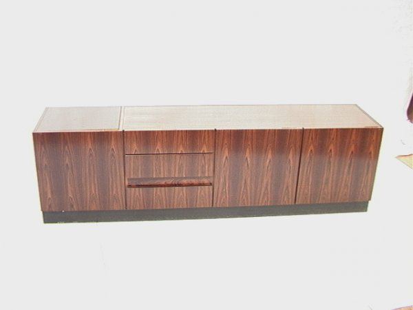 Danish Modern Rosewood Buffet Bar Cabinet. Top l: Danish Modern Rosewood Buffet Bar Cabinet. Top left section that mechanically. Nice rosewood grain. Dimensions: H: 23.5 inches: W: 83 inches: D: 18 inches Condition (General) Please contact us with sp