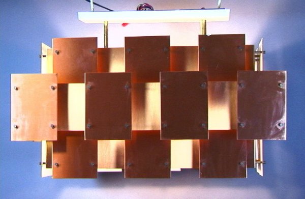 Early Robert Sonneman Hanging Chandelier Lamp. R: Early Robert Sonneman Hanging Chandelier Lamp. Rectangular Pendant Lamp in a Three Dimensional Layout of Copper Panels. All mounted with metal rods. Paper label. Copper panels are very similar to Henn