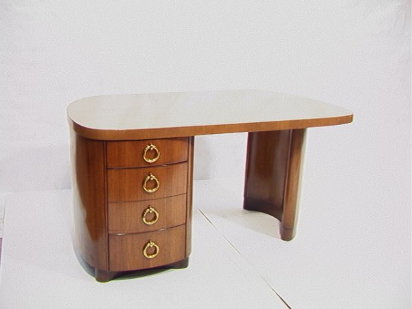 Art Deco Gilbert Rohde style Mahogany DESK with L: Art Deco Gilbert Rohde style Mahogany DESK with Large Brass Pulls. Elegant lines. Dimensions: H: 29 inches: W: 60 inches: D: 35 inches Condition (General) Please contact us with specific questions abo