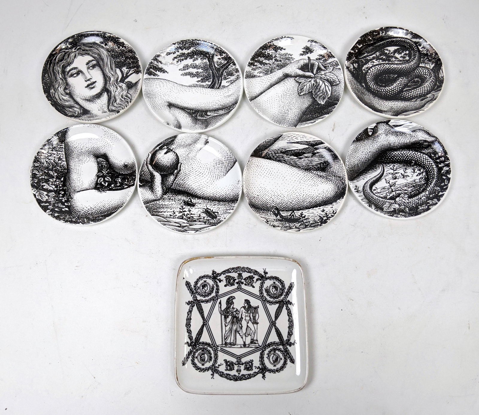 8pc PIERO FORNASETTI "Eva" Coasters. Plus Square Fornas: 8pc PIERO FORNASETTI "Eva" Coasters. Plus Square Fornasetti dish with Warriors Soldiers. Coasters marked EVA ; ADAMO ED EVA, 1965. -- Dimensions: : W: 5 inches: D: 5 inches ---