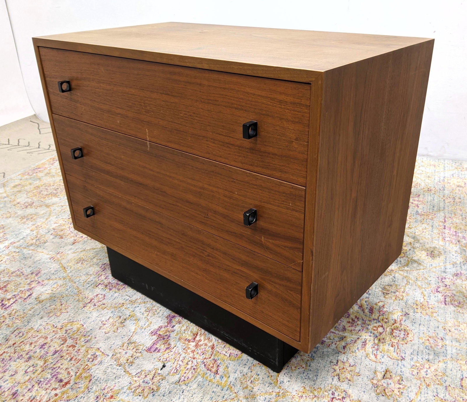 Canadian Walnut Bachelor's Chest. Ebonized recessed pla: Canadian Walnut Bachelor's Chest. Ebonized recessed platform base. Modernist pulls. Marked-- Dimensions: H: 27 inches: W: 32 inches: D: 18 inches ---