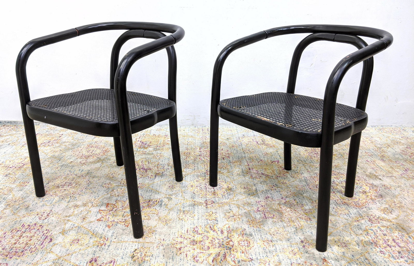 Pr Bentwood Caned Seat Arm Chairs. Black finish: Pr Bentwood Caned Seat Arm Chairs. Black finish-- Dimensions: H: 29 inches: W: 22 inches: D: 20 inches ---
