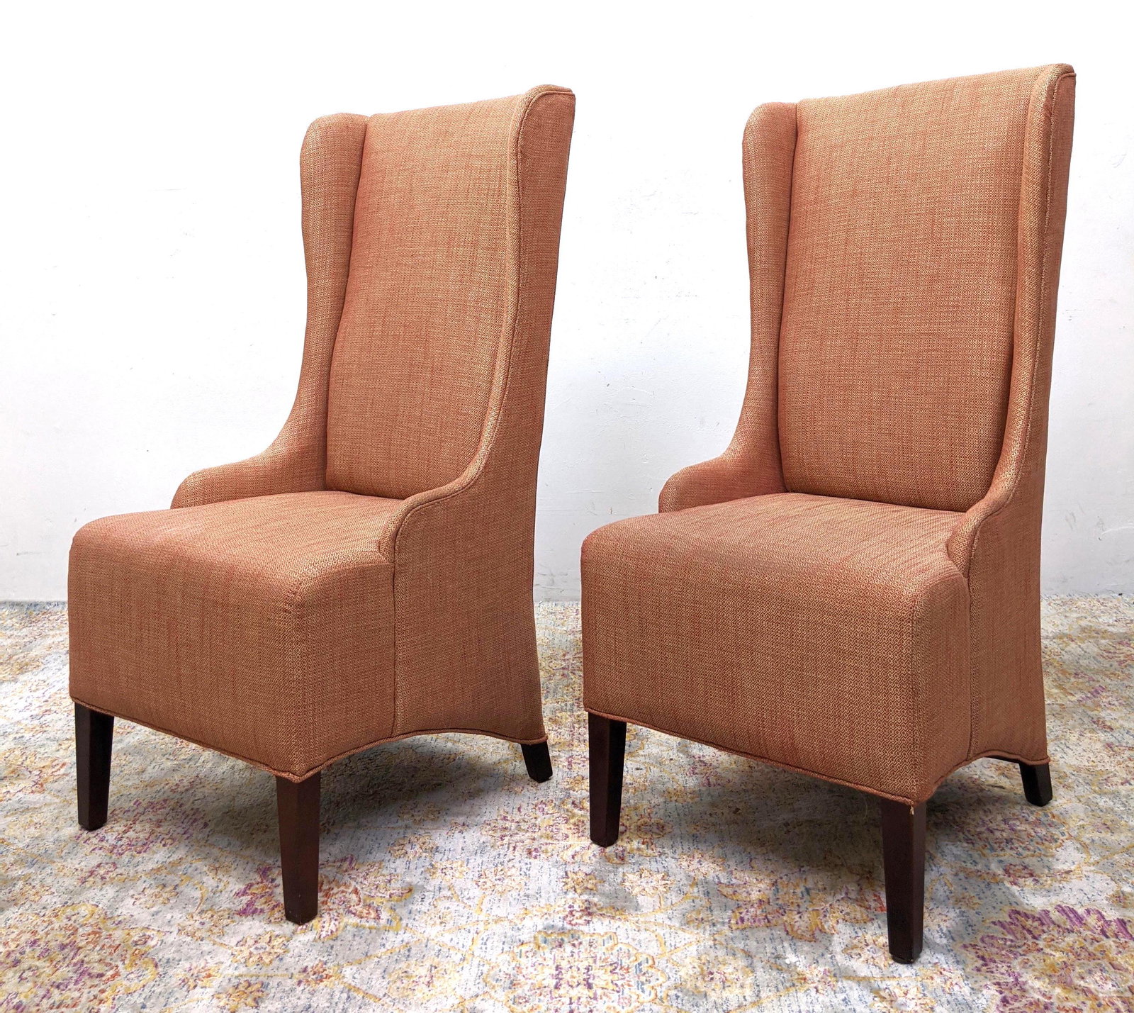 Pr Tall Back Wing Chairs. Tweedy upholstery on square: Pr Tall Back Wing Chairs. Tweedy upholstery on square wood legs. Arched skirts.-- Dimensions: H: 47 inches: W: 21 inches: D: 27 inches ---