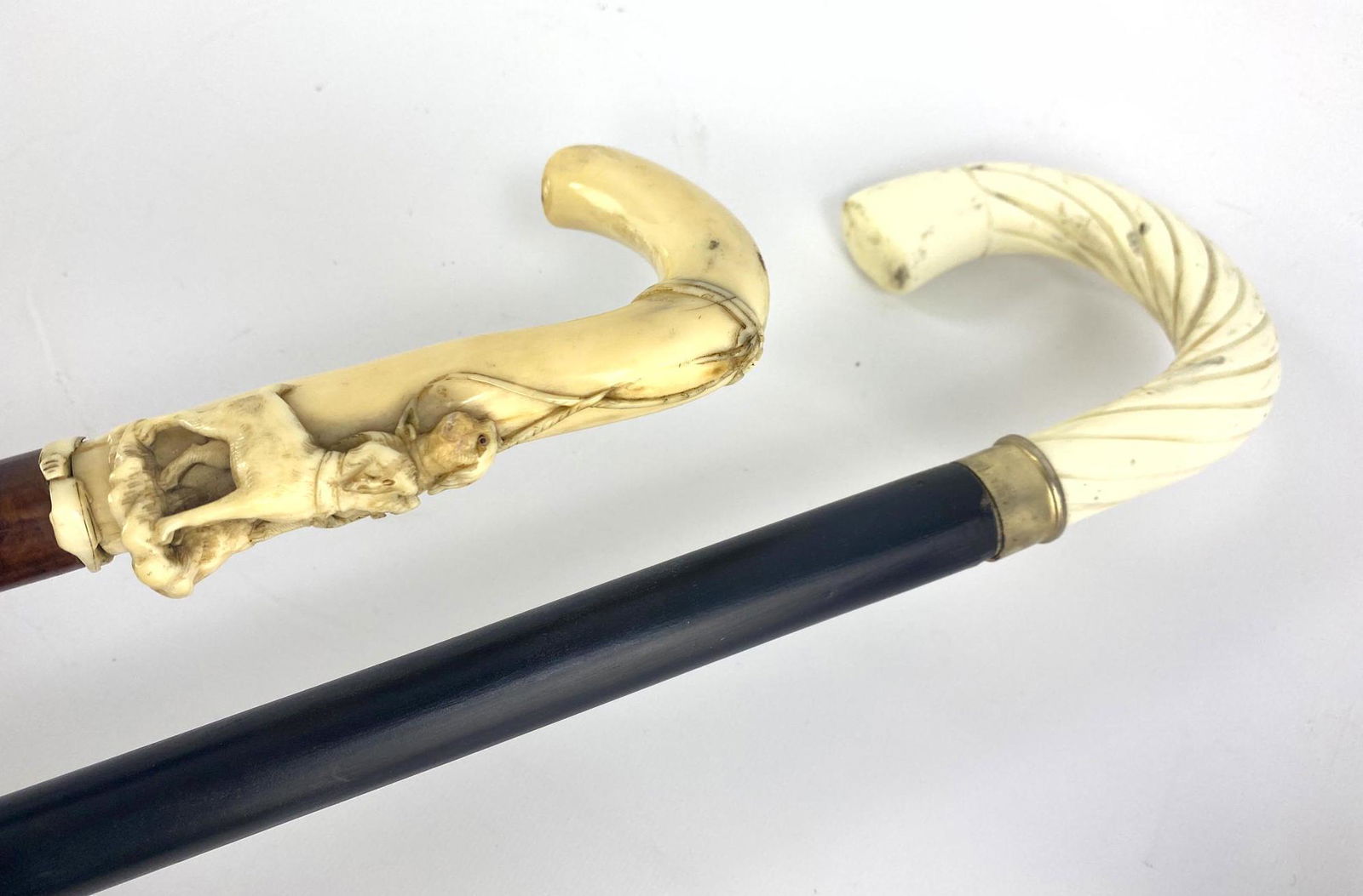 2 Carved Walking Stick Canes. One carved with two hunti (1 of 9)