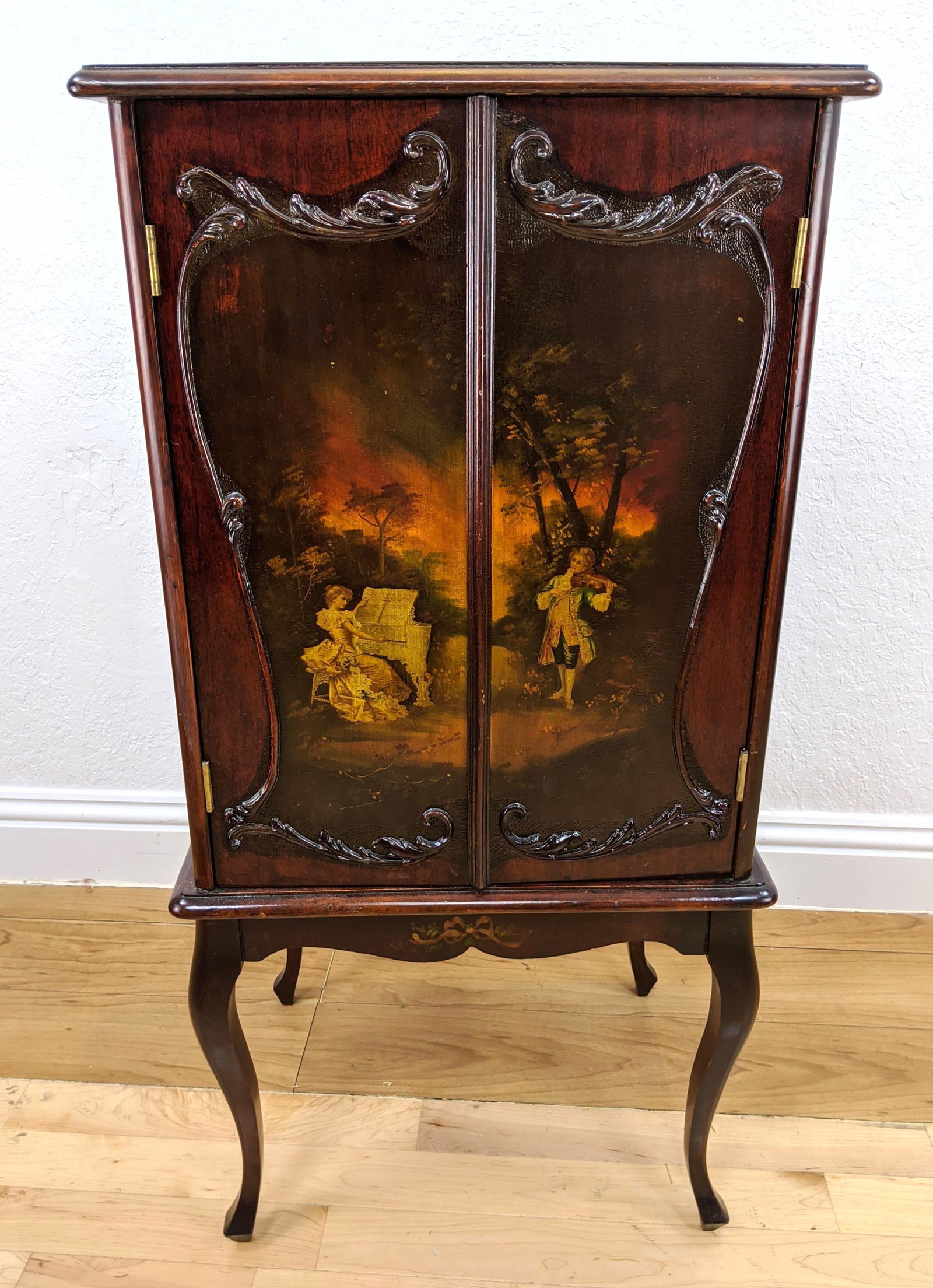 Hand Painted Music Cabinet. Floral design on top. Frenc: Hand Painted Music Cabinet. Floral design on top. French legs. Interior drawers. Mechanical handle that opens doors-- Dimensions: H: 42 inches: W: 21 inches: D: 16 inches ---