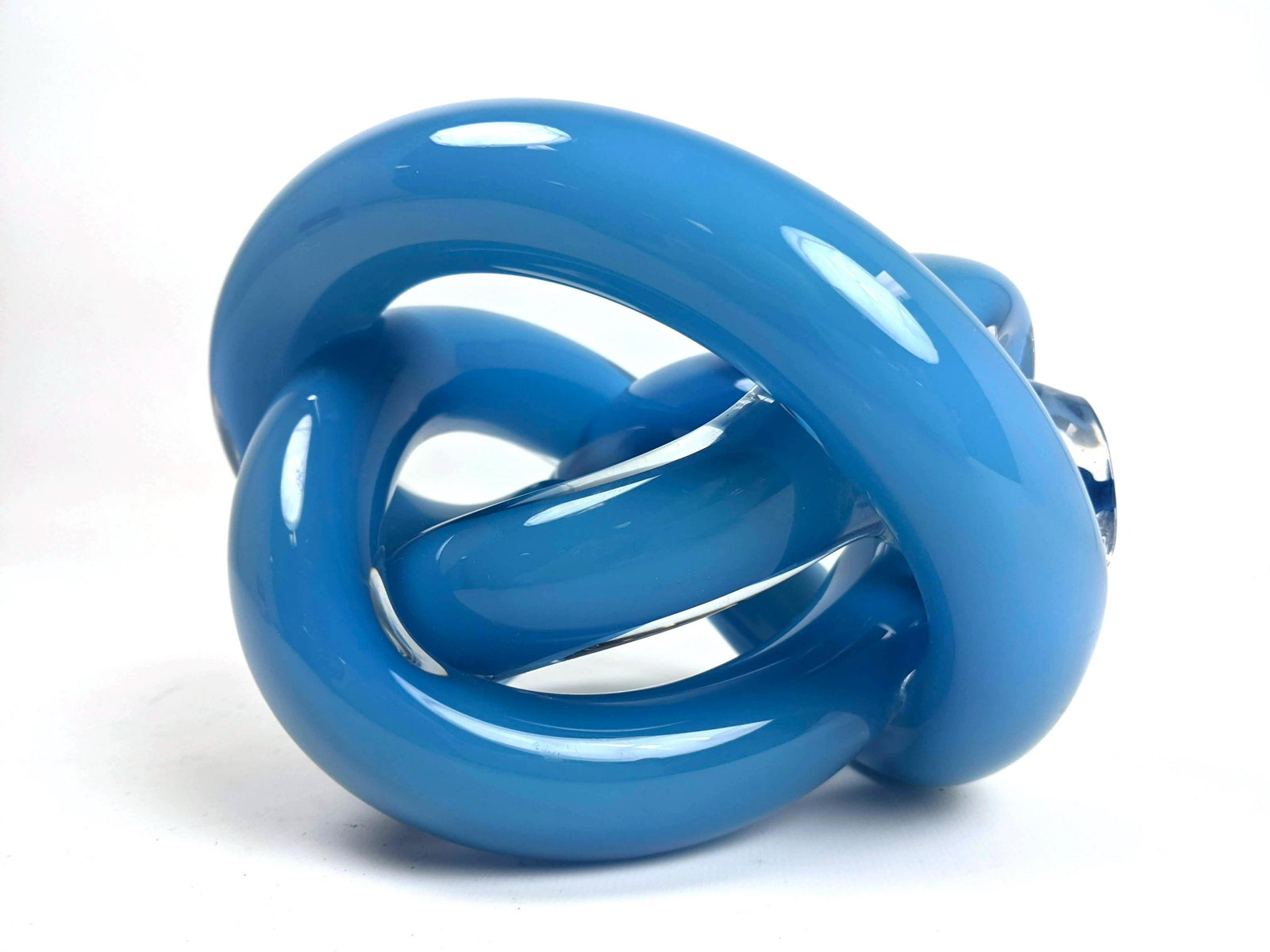 SKLO STUDIO Knotted Art Glass Sculpture. Cased light bl: SKLO STUDIO Knotted Art Glass Sculpture. Cased light blue glass. Label; Handmade in Czech Republic. -- Dimensions: H: 5 inches: W: 7 inches: D: 6.5 inches ---