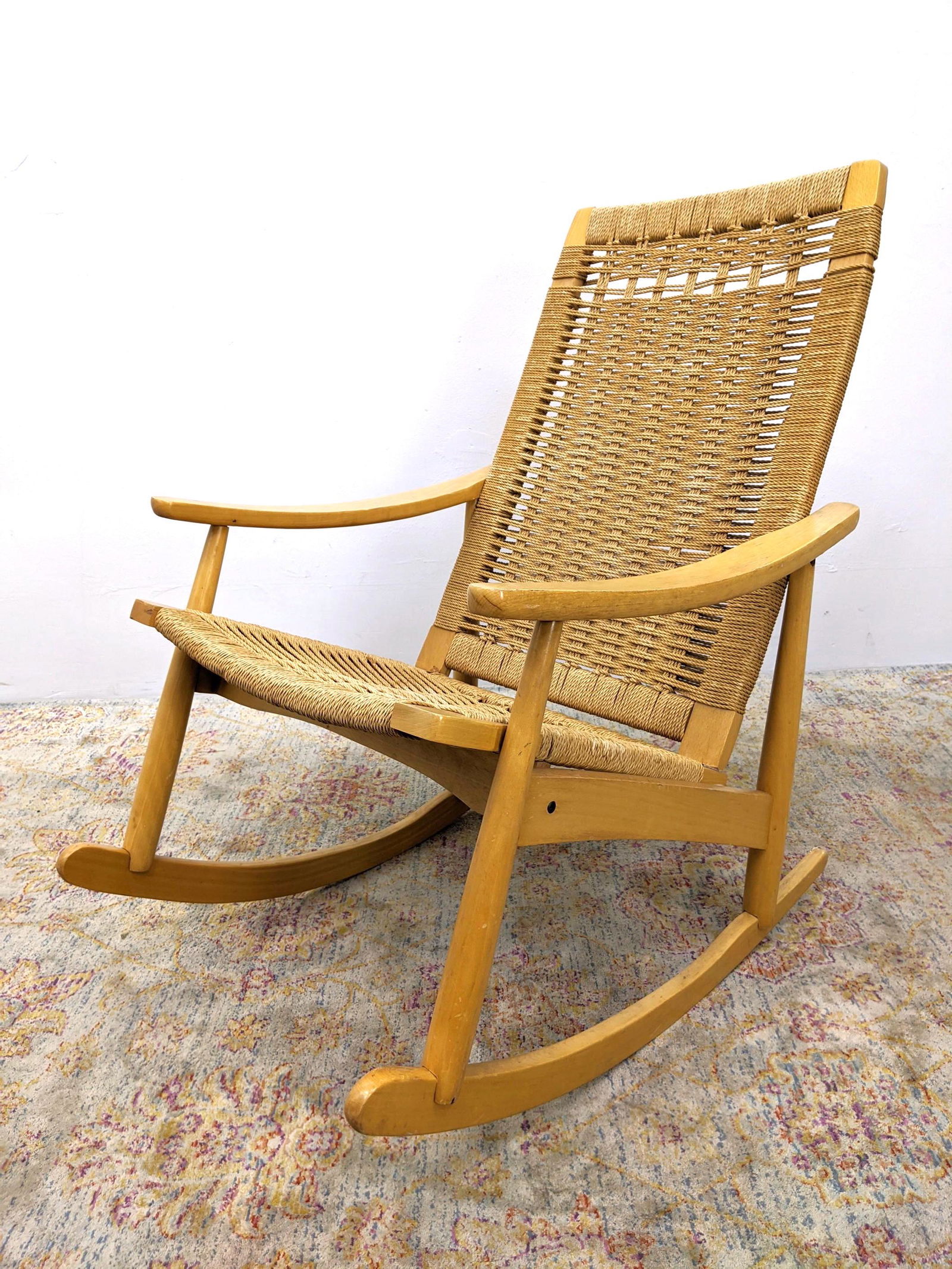 Modern Rocking Chair. Blond wood frame with woven rush: Modern Rocking Chair. Blond wood frame with woven rush seat and back.-- Dimensions: H: 36.5 inches: W: 24 inches: D: 34 inches ---