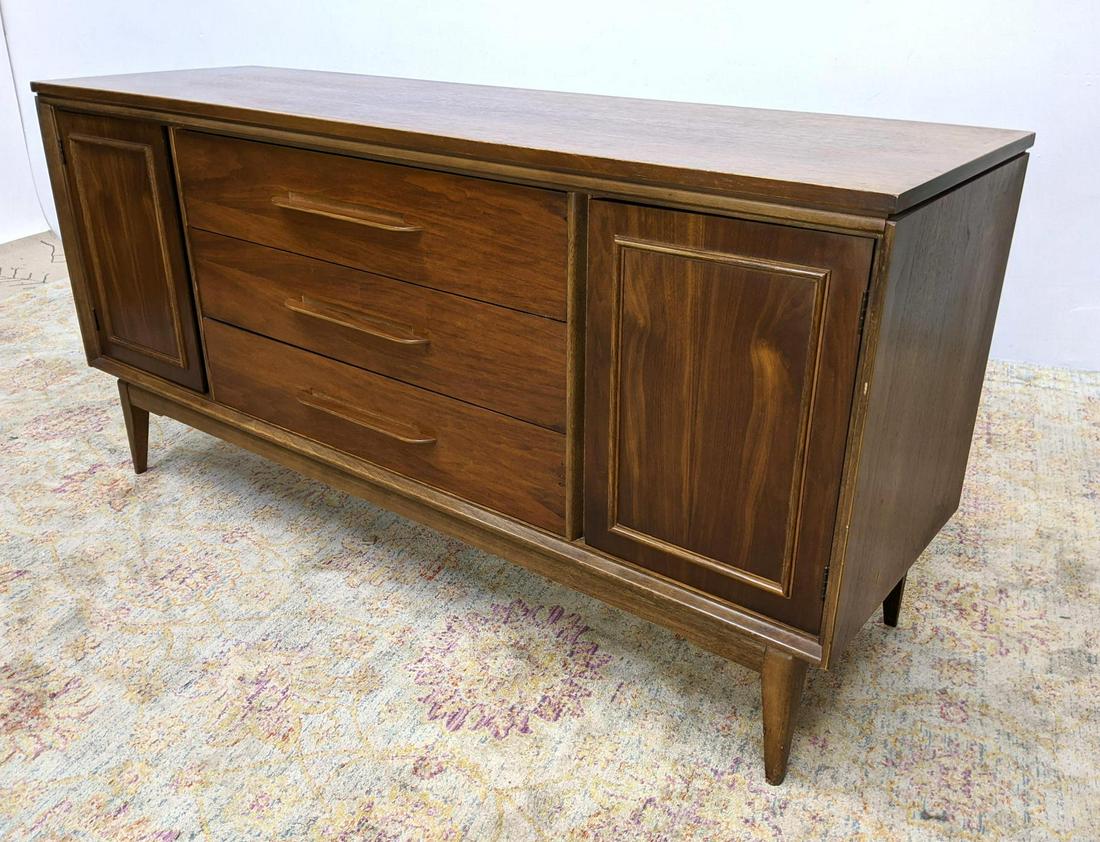 BASSETT Walnut Modernist Credenza Dresser Chest Drawers: BASSETT Walnut Modernist Credenza Dresser Chest Drawers. Raised on tapered legs. Marked. Carlton Walnut. The Impact Collection. -- Dimensions: H: 31 inches: W: 62.5 inches: D: 19 inches ---