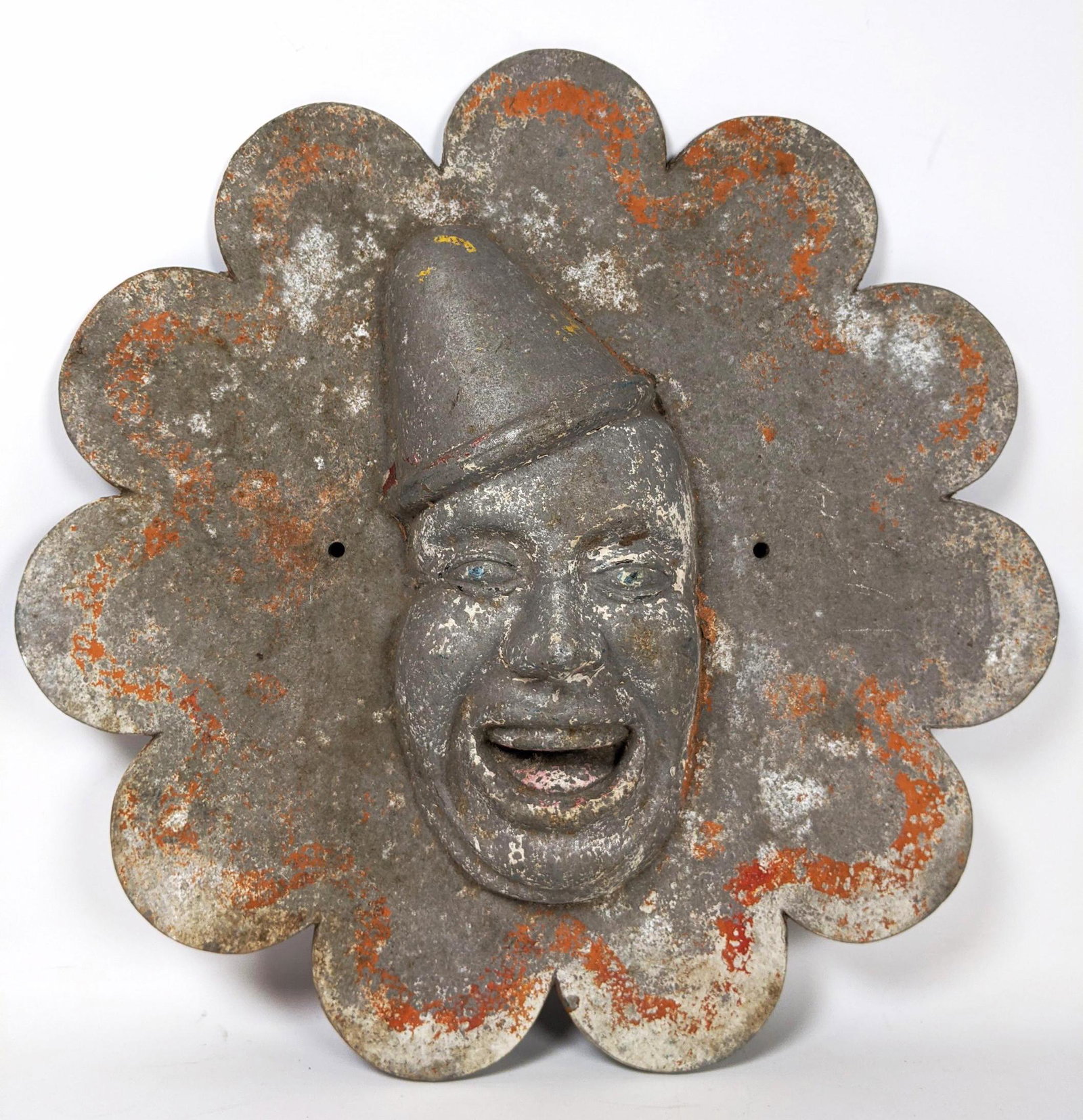 Cast Aluminum Clown Wall Plaque. The Tinman Relief Wall: Cast Aluminum Clown Wall Plaque. The Tinman Relief Wall Sign. Remnants of paint.-- Dimensions: H: 17 inches: W: 17 inches: D: 3 inches ---