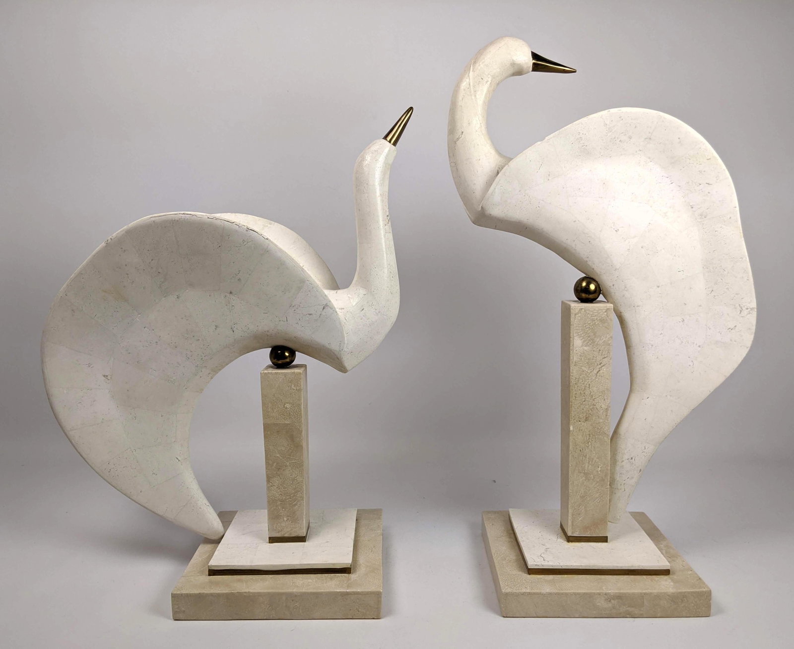 Pr Marble Tesserae Tile Elegant Bird Sculptures. Two bi: Pr Marble Tesserae Tile Elegant Bird Sculptures. Two birds resting on stands. Brass beaks and accents. Different poses. Label. -- Dimensions: H: 20 inches: W: 11 inches: D: 7 inches ---