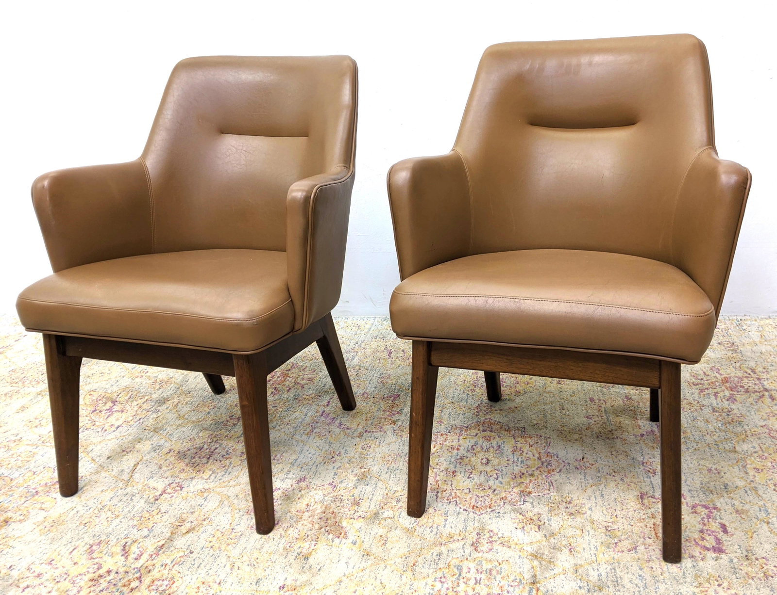 Pr BOLING, N.C. Brown Upholstered Lounge Chairs. Arm Ch: Pr BOLING, N.C. Brown Upholstered Lounge Chairs. Arm Chairs with angled backs. Walnut stained legs. Company label states made in March 1980-- Dimensions: H: 33 inches: W: 24.5 inches: D: 24 inches ---