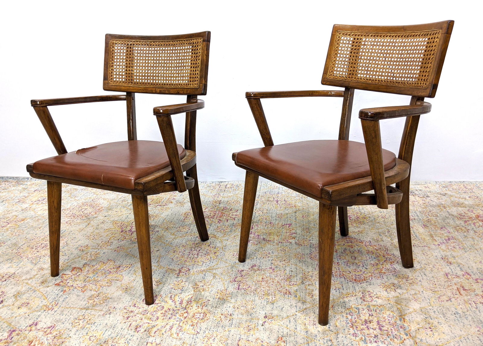 Modern Caned Backrest Arm Chairs. Brown Vinyl. FT: Modern Caned Backrest Arm Chairs. Brown Vinyl. FT-- Dimensions: H: 34.5 inches: W: 23 inches: D: 21 inches ---