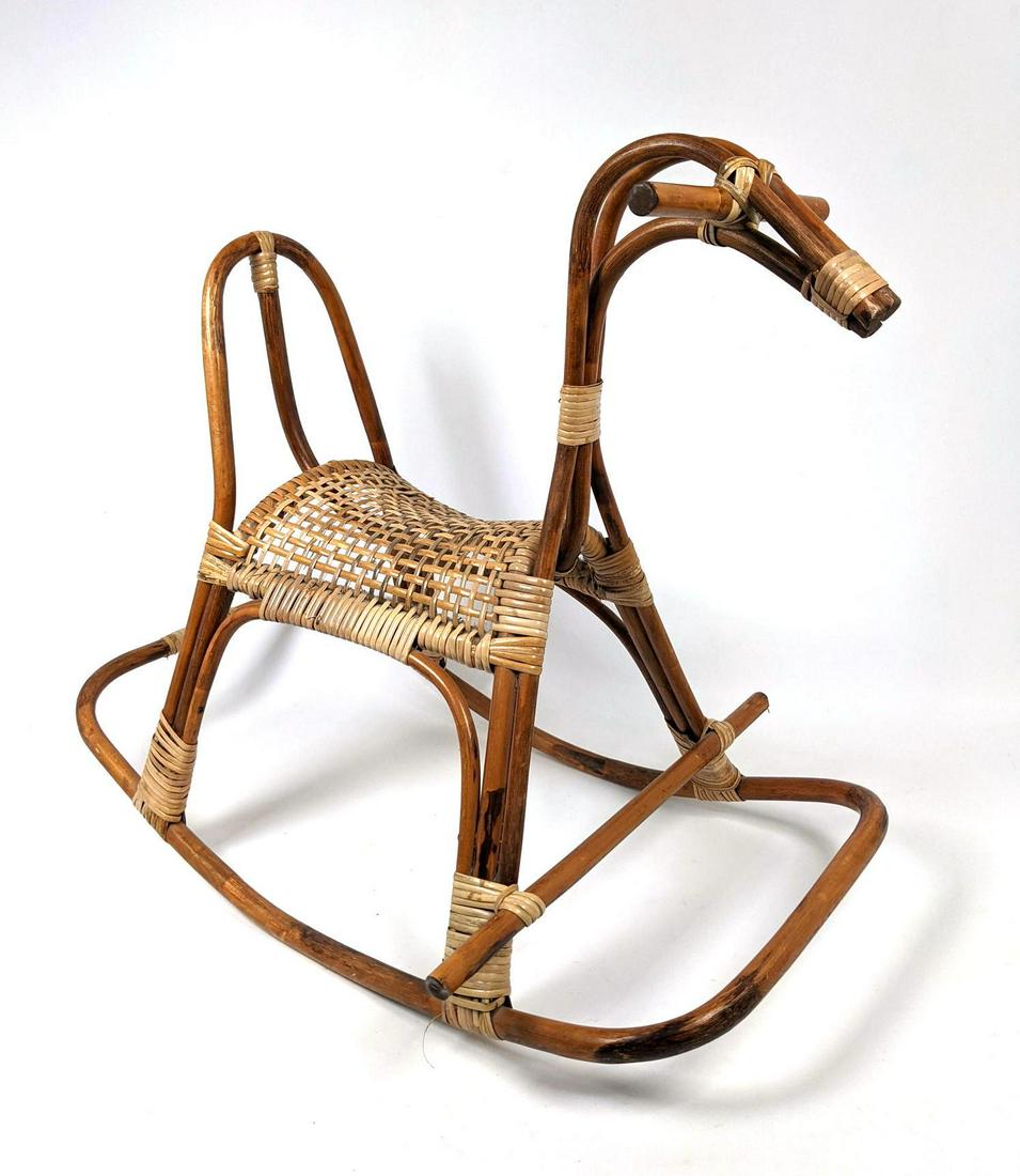 Albini style Bamboo and Rattan Rocking Horse. Woven sea: Albini style Bamboo and Rattan Rocking Horse. Woven seat and wrapped details.-- Dimensions: H: 24 inches: W: 18 inches: D: 29 inches ---