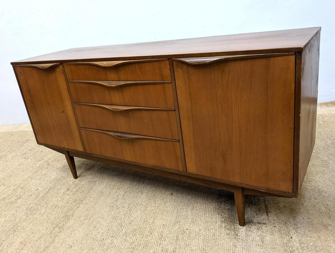 American Modern Credenza Sideboard on Legs. SUTCLIFFE o: American Modern Credenza Sideboard on Legs. SUTCLIFFE of TODMORDEN. Sculptural wood handles. Label-- Dimensions: H: 29.5 inches: W: 60 inches: D: 18 inches ---