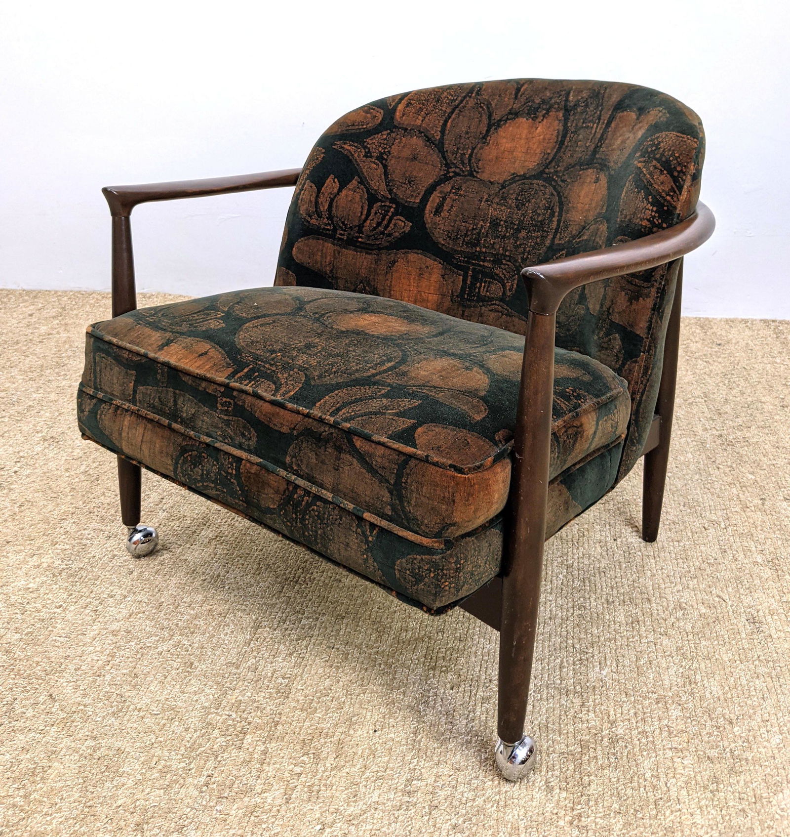 Jack Lenor Larsen Upholstered Walnut Lounge Chair. Open: Jack Lenor Larsen Upholstered Walnut Lounge Chair. Open Arm Frame. Silver casters on front legs. -- Dimensions: H: 27 inches: W: 30 inches ---