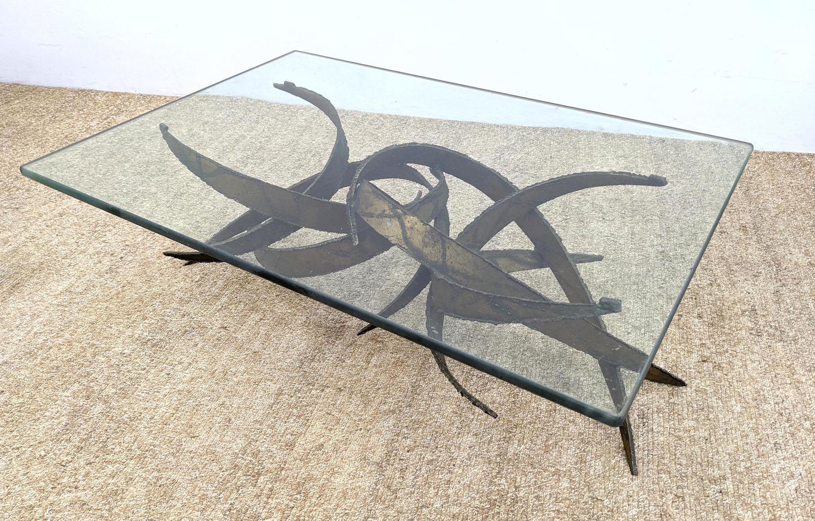 Silas Seandel style Brutalist Metal Coffee Table. Glas: Silas Seandel style Brutalist Metal Coffee Table. Glass top on Torch welded curved metal form base. -- Dimensions: H: 15 inches: W: 44 inches: D: 31 inches ---
