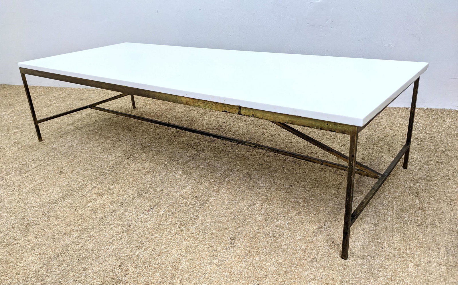 PAUL McCOBB Brass Frame Cocktail Coffee Table. Thick w: PAUL McCOBB Brass Frame Cocktail Coffee Table. Thick white milk glass top. Unusual triangle stretcher. -- Dimensions: H: 15 inches: W: 60 inches: D: 24 inches ---