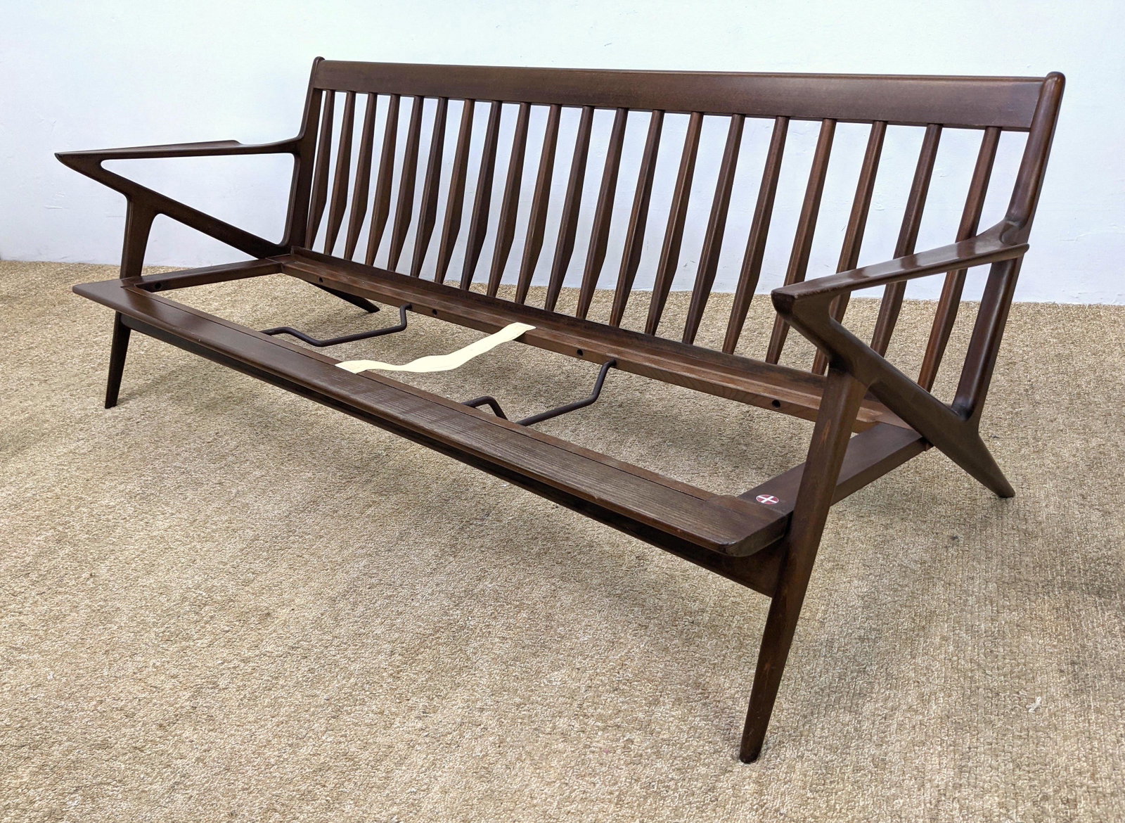 Poul Jensen Danish Modern Sofa Couch Frame. Angled Open: Poul Jensen Danish Modern Sofa Couch Frame. Angled Open Arms. Shaped Spindle back. Frame Only; No Cushions. SELIG metal tag-- Dimensions: H: 27 inches: W: 74 inches: D: 32 inches ---